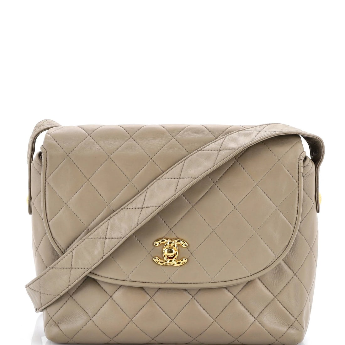 Round Flap Lambskin Bag Large Quilted Chanel Vintage: Round Flap Lambskin Bag Large Quilted Chanel Vintage Round Flap Lambskin Bag with Quilted Chanel Design, a timeless piece featuring neutral exterior and rich brown interior, adorned with gold hardware