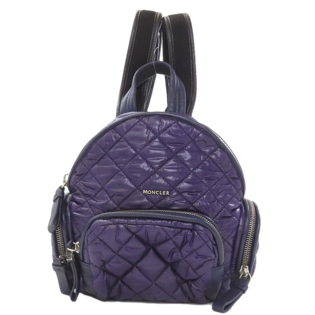 Nylon Backpack Daypack Moncler: Nylon Backpack Daypack Moncler Navy nylon backpack with a sleek Moncler design, perfect for daily use. The backpack's exterior is made of durable nylon, providing a long-lasting and water-resistant