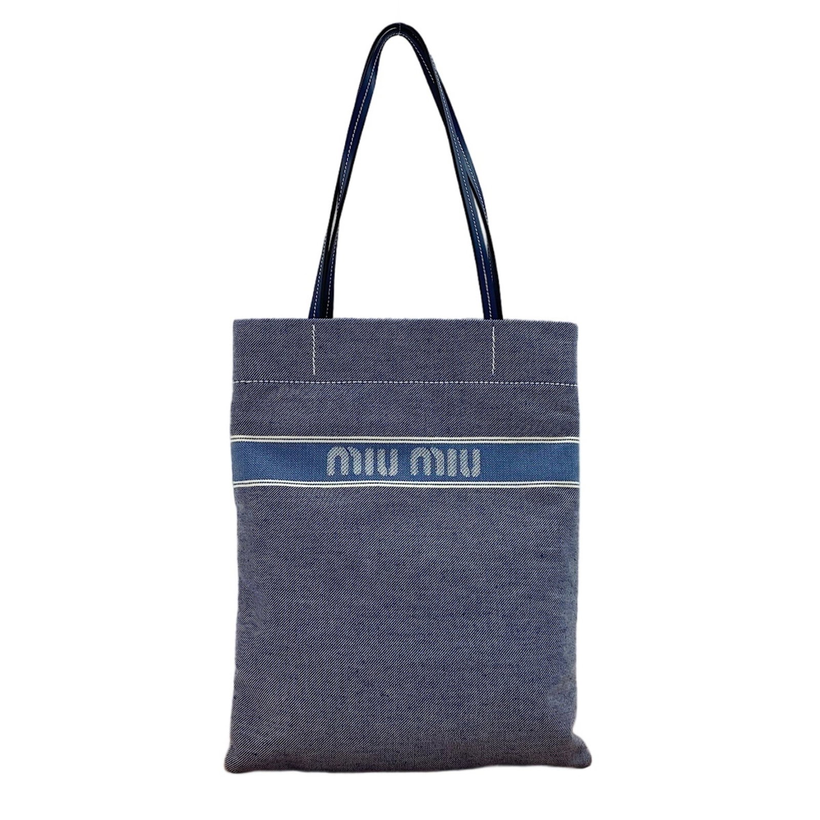 Tote Bag Denim Miu: Tote Bag Denim Miu Denim tote bag from Miu Miu, crafted from sturdy denim fabric in a vibrant blue hue. Measuring 40cm x 31cm x 1cm, this compact tote features a classic design with a signature. The