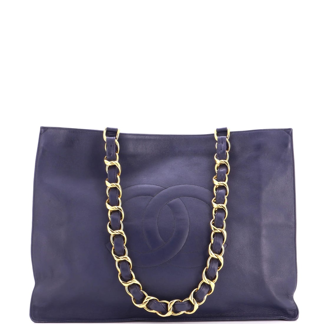 Lambskin Vintage Chain Tote Chanel CC: Lambskin Vintage Chain Tote Chanel CC Heavy creases, scuffs, and edge wear adorn this vintage Chanel CC chain tote, giving it a unique, worn-in look. The lambskin exterior in blue provides a rich,