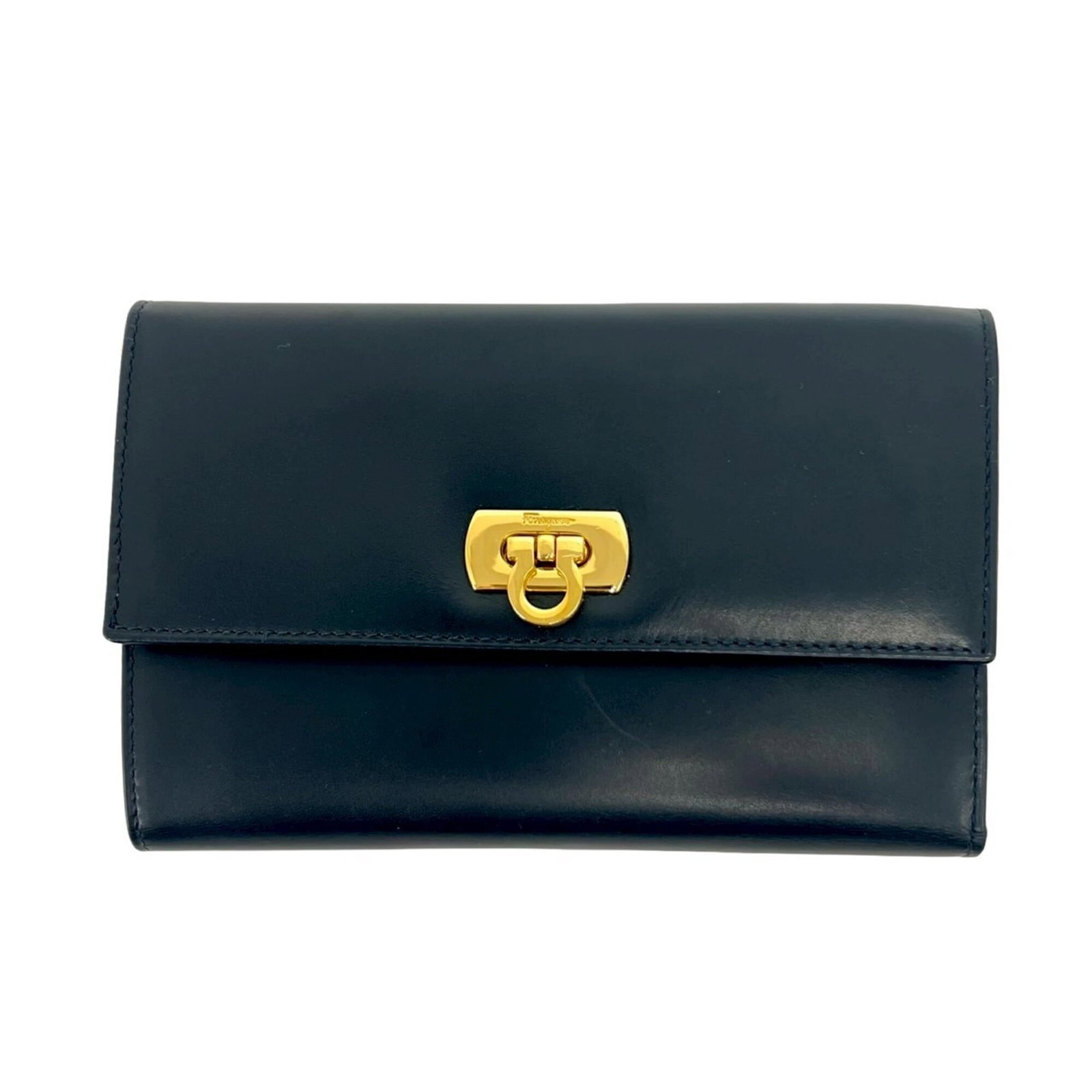 Salvatore Ferragamo Wallet (Tri-Fold) Leather: Salvatore Ferragamo Wallet (Tri-Fold) Leather The Salvatore Ferragamo tri-fold leather wallet is a classic design with a timeless navy color. Made from high-quality leather, this wallet measures 10cm