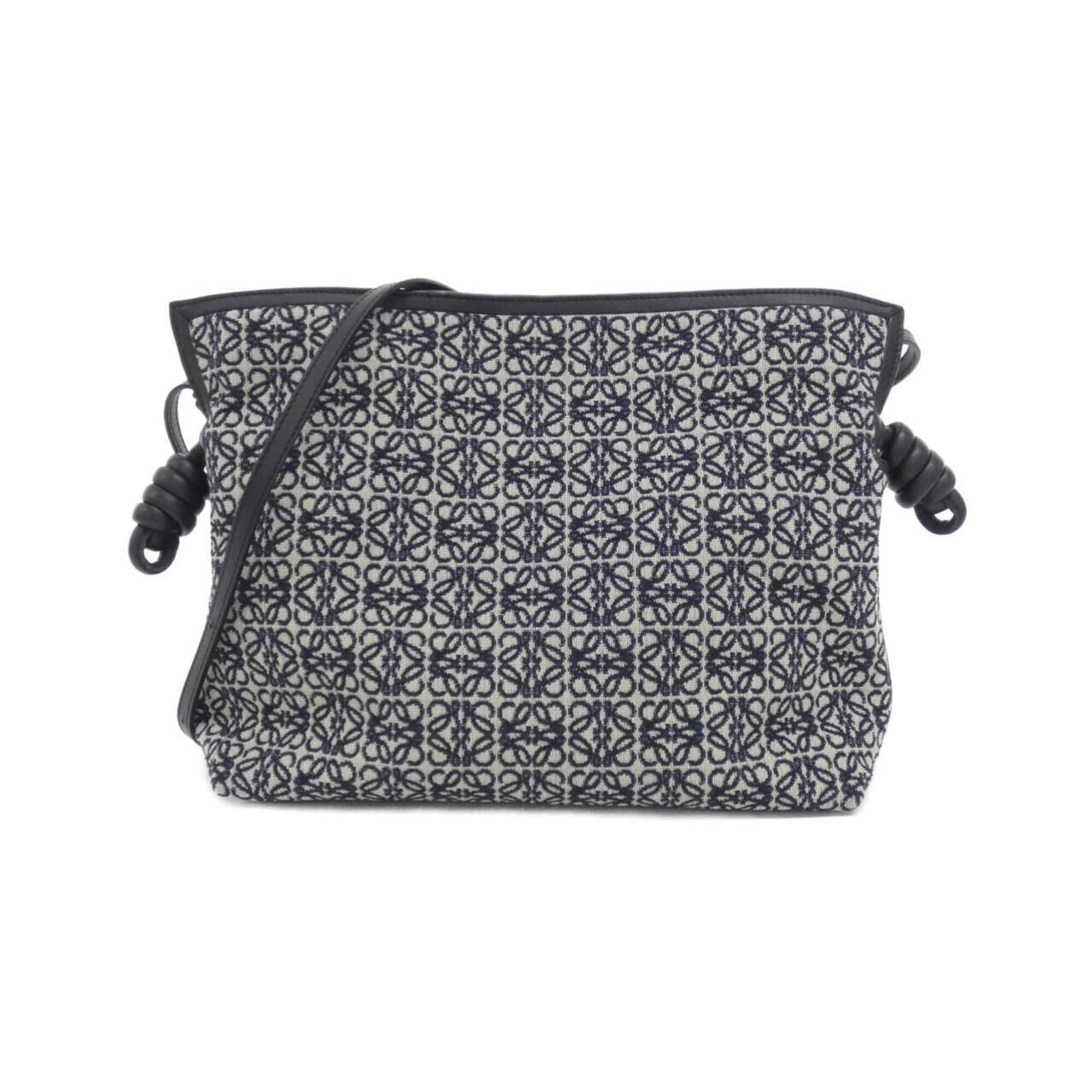 Canvas Leather Handbag Loewe: Canvas Leather Handbag Loewe Canvas Leather Handbag Loewe bears a signature. Made from canvas and calfskin leather, this black and navy handbag measures 24cm x 29cm x 9cm. Its unique design makes it