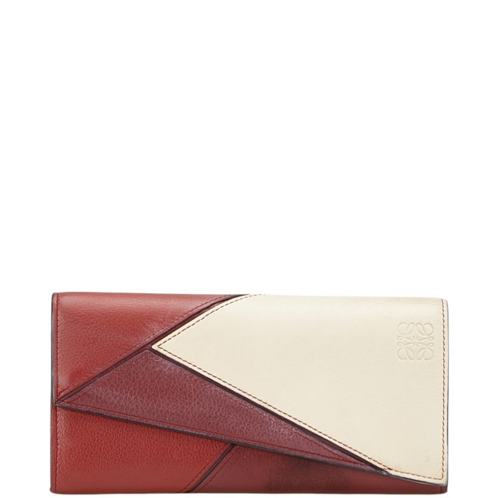 Loewe Coin Purse/ Coin Case Leather: Loewe Coin Purse/ Coin Case Leather The Loewe Coin Purse is a sleek and stylish accessory, featuring a bold red leather exterior with a white interior. This classic design is secured with a button clo