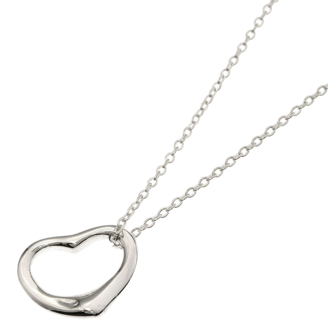Open Heart Necklace by Tiffany & Co: Open Heart Necklace by Tiffany & Co Open Heart Necklace by Tiffany & Co is a sleek and modern silver necklace featuring a striking design. Made from high-quality silver metal, this necklace boasts a