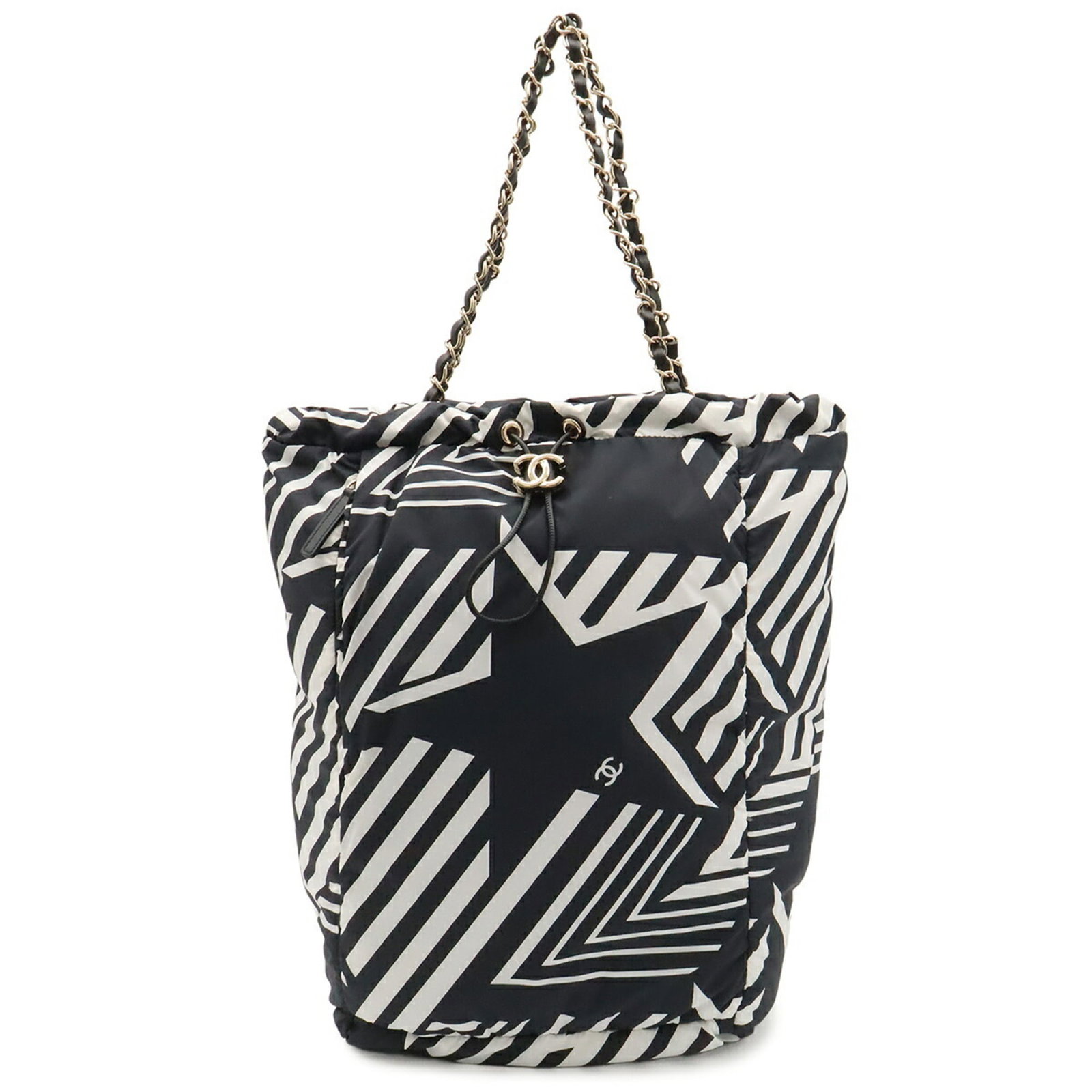 Nylon Chanel Backpack Bag: Nylon Chanel Backpack Bag This black and white nylon backpack bag from Chanel features a sleek design with a size of 42cm x 25.5cm x 17.5cm. The nylon material provides a durable and versatile option