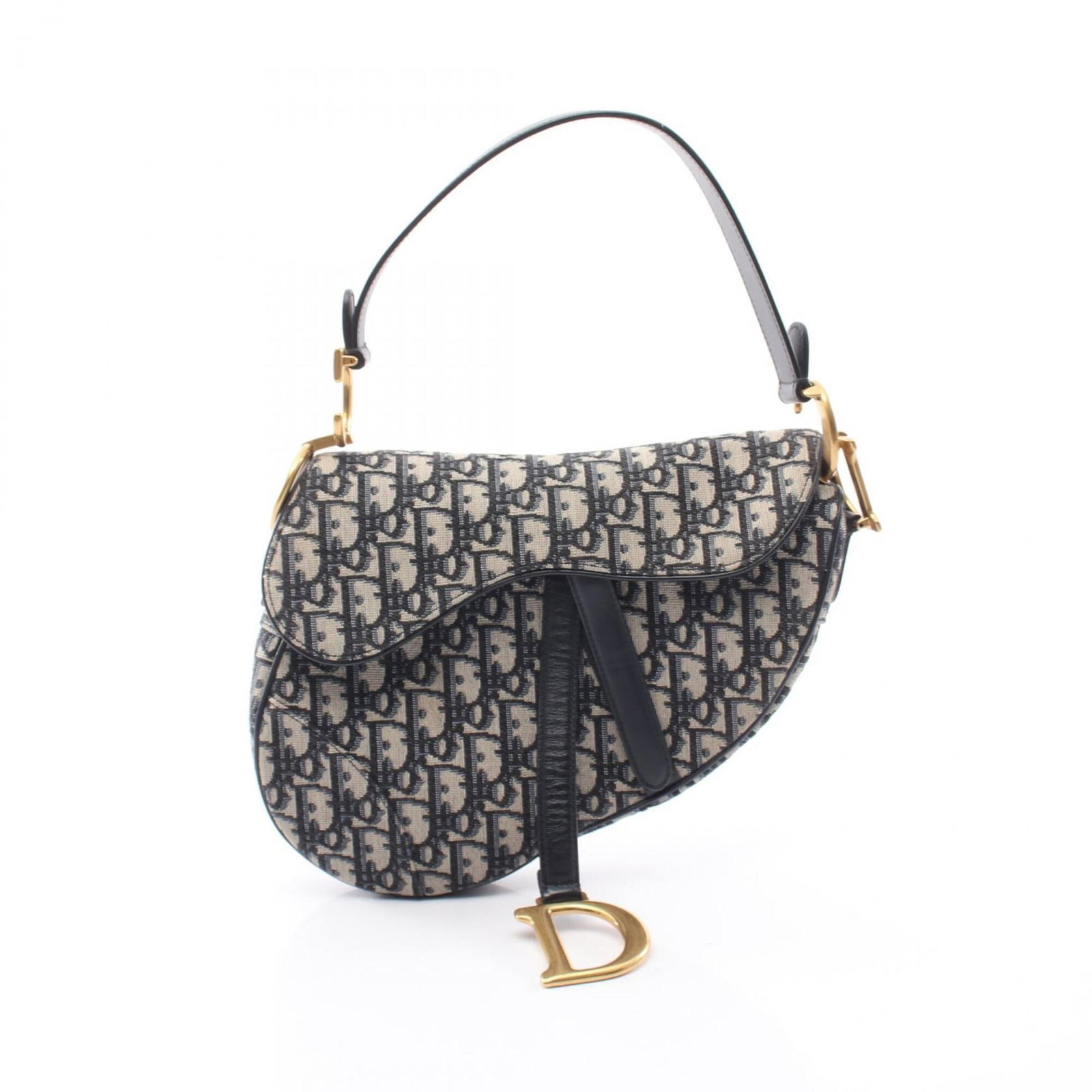 Christian Dior Leather Canvas Saddle Bag: Christian Dior Leather Canvas Saddle Bag Canvas and leather combine in this Christian Dior Saddle Bag, featuring a beige and navy color combination. With its 17cm x 24cm x 6cm dimensions, this bag is