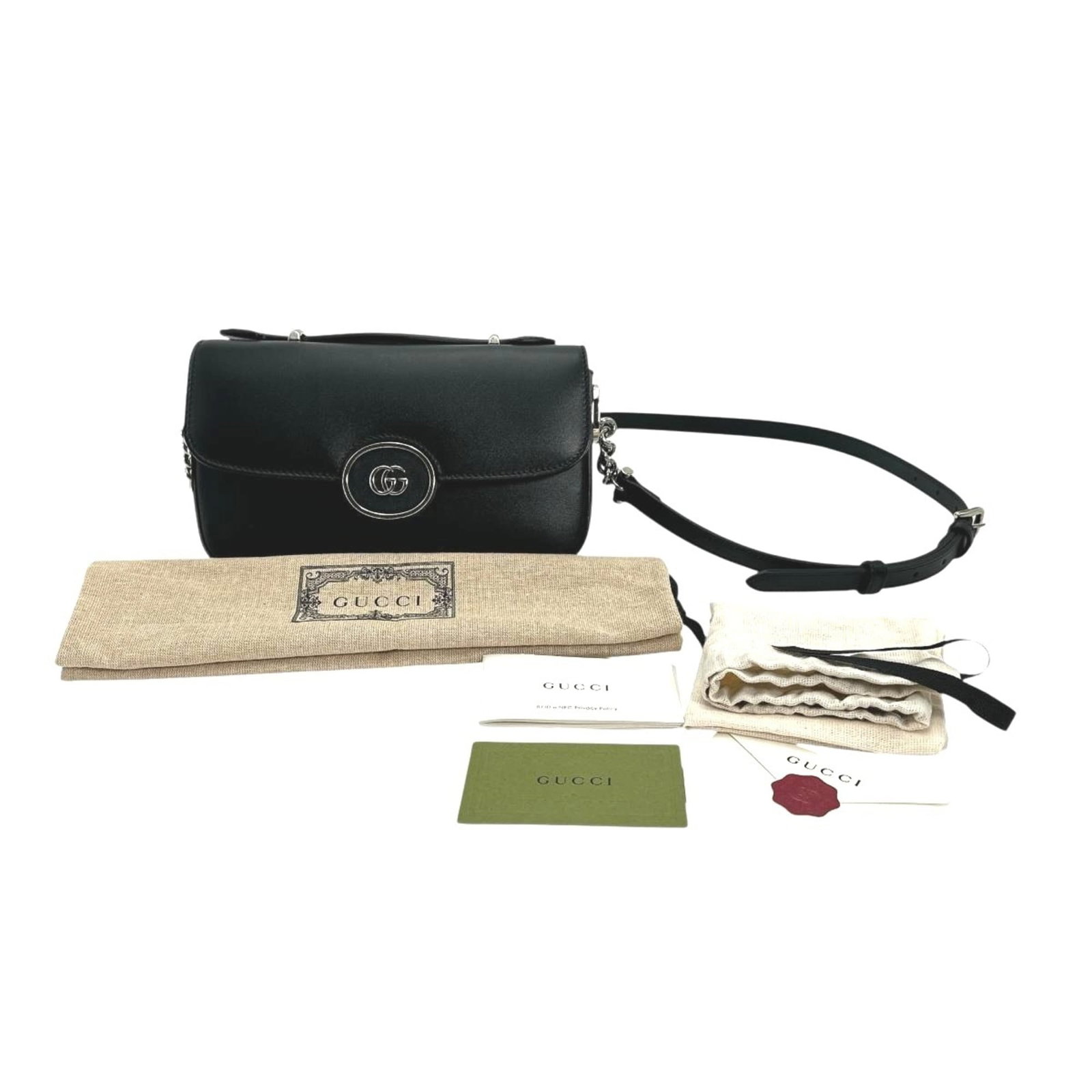 Shoulder Bag Leather: Shoulder Bag Leather Black leather shoulder bag with dust bag and manual, measuring 12cm x 21cm x 5.5cm. This Gucci shoulder bag features high-quality leather construction and comes with a shoulder st