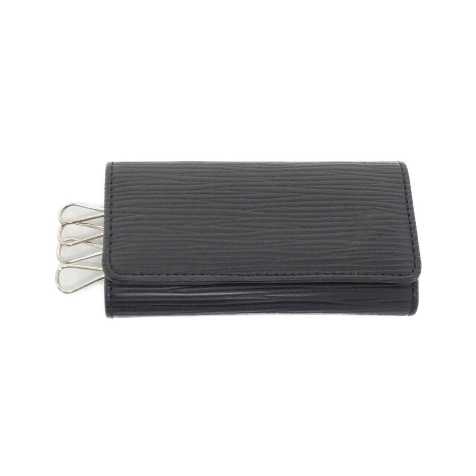 Keycase Leather Louis Vuitton: Keycase Leather Louis Vuitton Black leather keycase from Louis Vuitton, measuring 6cm x 11cm x 1.5cm. This compact keycase is made from high-quality leather and features a classic design. Its sleek