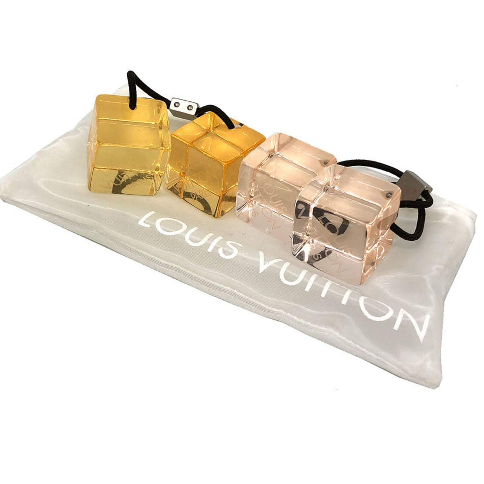 Louis Vuitton Hair Tie: Louis Vuitton Hair Tie Pink or Yellow Louis Vuitton Hair Tie with Case. This hair tie is a compact accessory featuring the iconic Louis Vuitton brand, available in two color options. The item comes in