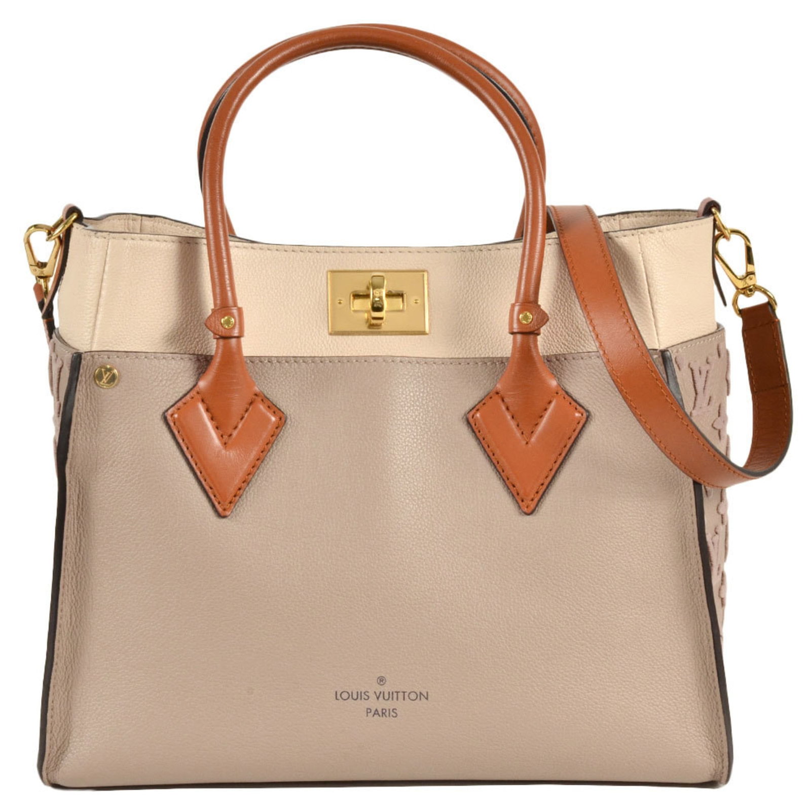 Handbag Leather Louis Vuitton: Handbag Leather Louis Vuitton The Louis Vuitton M53825 handbag is a classic design featuring a beige leather exterior with an open pocket on the front and a zipper pocket on the side. This stylish