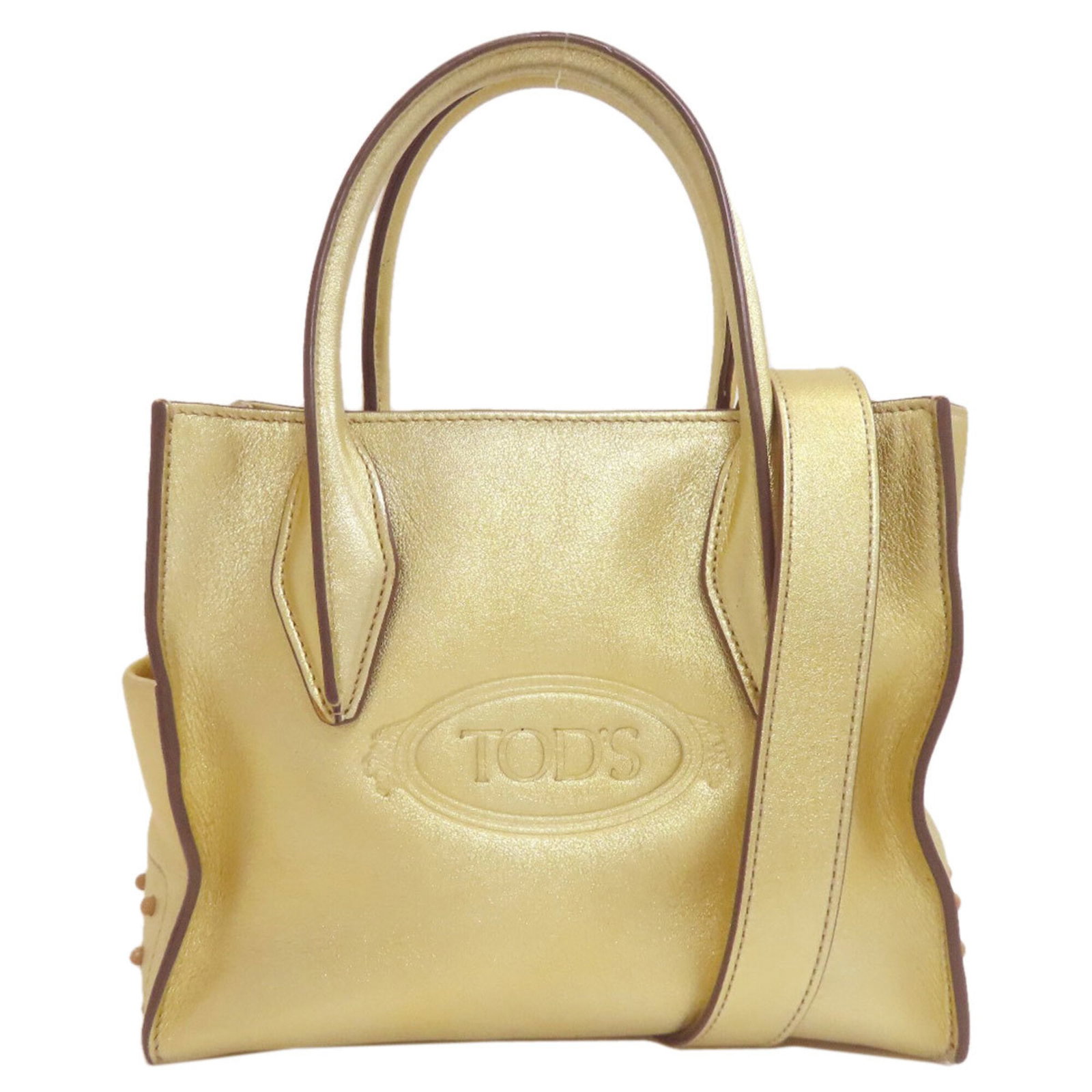Handbag Leather Tod'S: Handbag Leather Tod'S Handbag Leather Tod's - A Timeless Gold ClassicThe Tod's gold leather handbag boasts a sleek 17cm x 20.5cm x 11cm design, featuring a sturdy zipper closure and adjustable strap