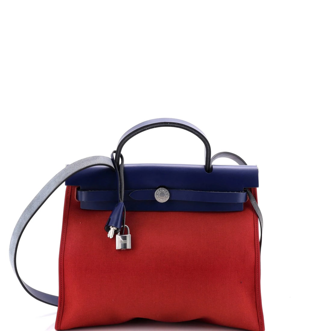 Herbag Hermes Leather Toile 31 Zip: Herbag Hermes Leather Toile 31 Zip The Herbag Hermes Leather Toile 31 Zip is a vibrant red shoulder bag with a striking blue interior, featuring a Palladium lock and a pochette clochette for added