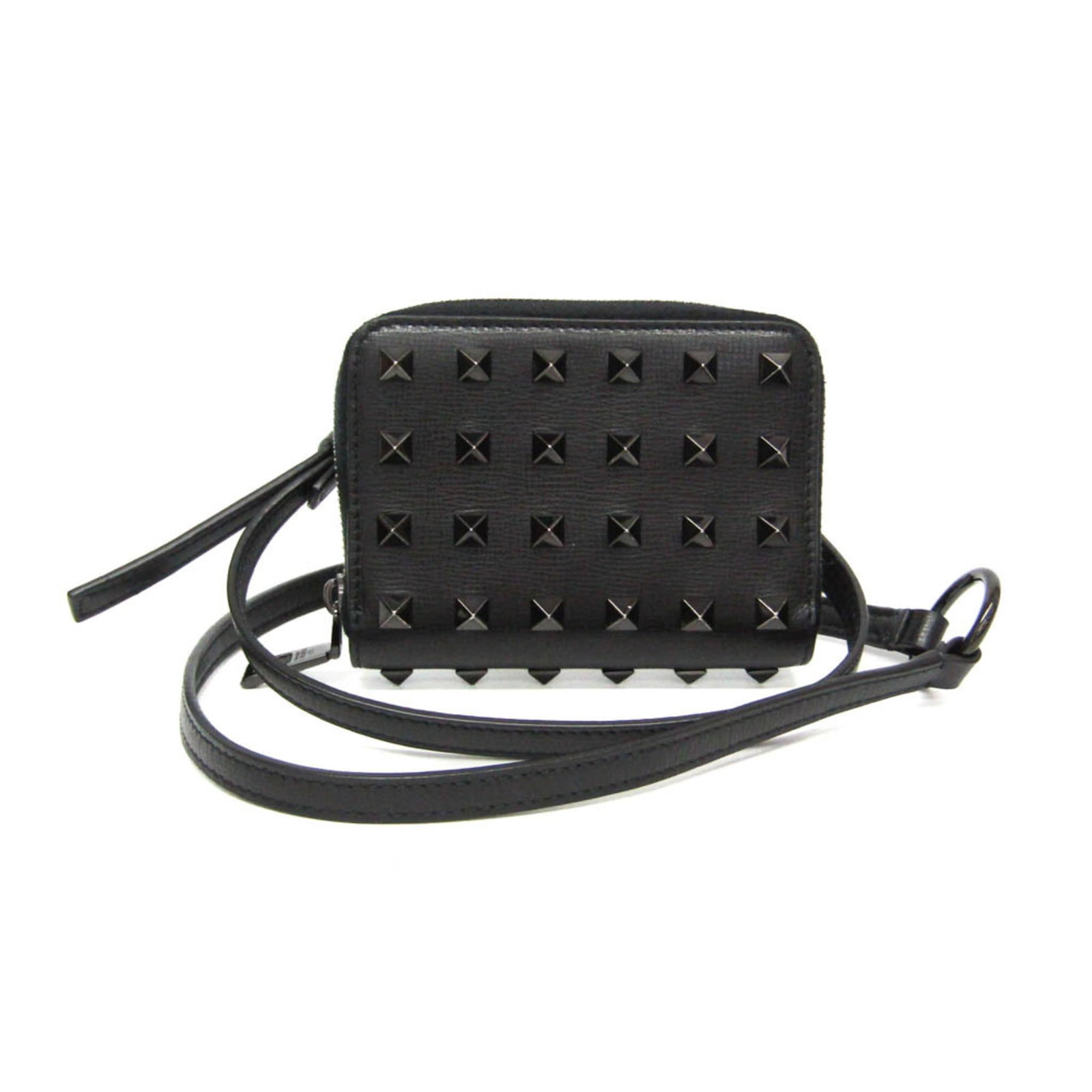 Garavani Valentino Coin Leather Purse: Garavani Valentino Coin Leather Purse The Garavani Valentino Coin Leather Purse is a sleek and sophisticated accessory, boasting a classic design with a modern twist. Its black leather exterior is com