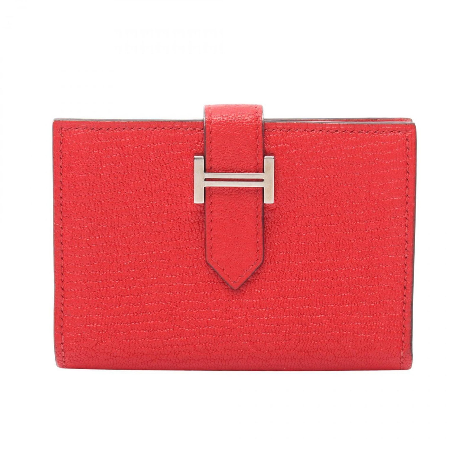 Chevre leather card case by Hermes: Chevre leather card case by Hermes Chevre leather card case by Hermes features a bold red color and a sleek, compact design. Made from high-quality chevre leather, this card case measures 7cm x 10cm