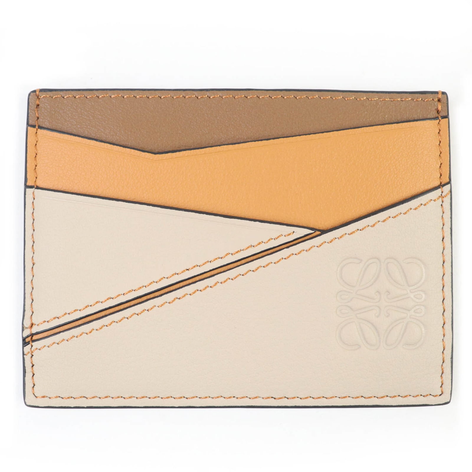 Card Case Leather by Loewe: Card Case Leather by Loewe Card Case Leather by Loewe is a brown leather card case with an inner card holder, measuring 7.5cm x 10cm. It comes with a box and dust bag for storage and protection. This 