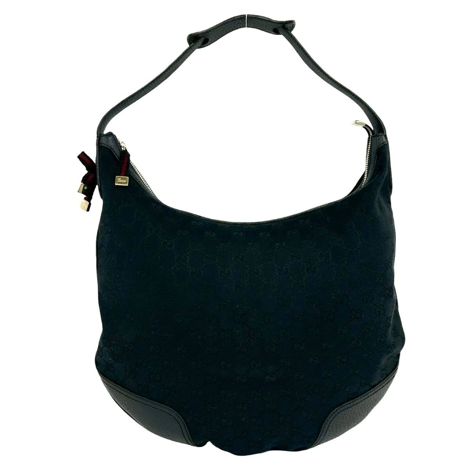 Canvas Leather Bag Shoulder Gucci: Canvas Leather Bag Shoulder Gucci Canvas Leather Bag Shoulder Gucci. This black canvas and leather shoulder bag features a classic design with a 32cm x 38.5cm size. The bag bears a signature, and its