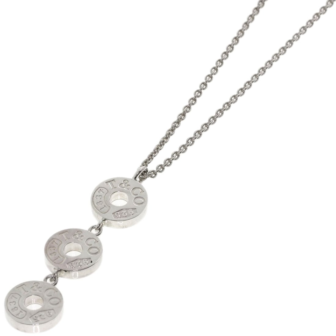Silver Tiffany Co 1837 Necklace Triple Circle: Silver Tiffany Co 1837 Necklace Triple Circle Silver Tiffany Co 1837 Necklace Triple Circle is a striking silver necklace featuring a unique triple circle design. Made from high-quality silver metal,
