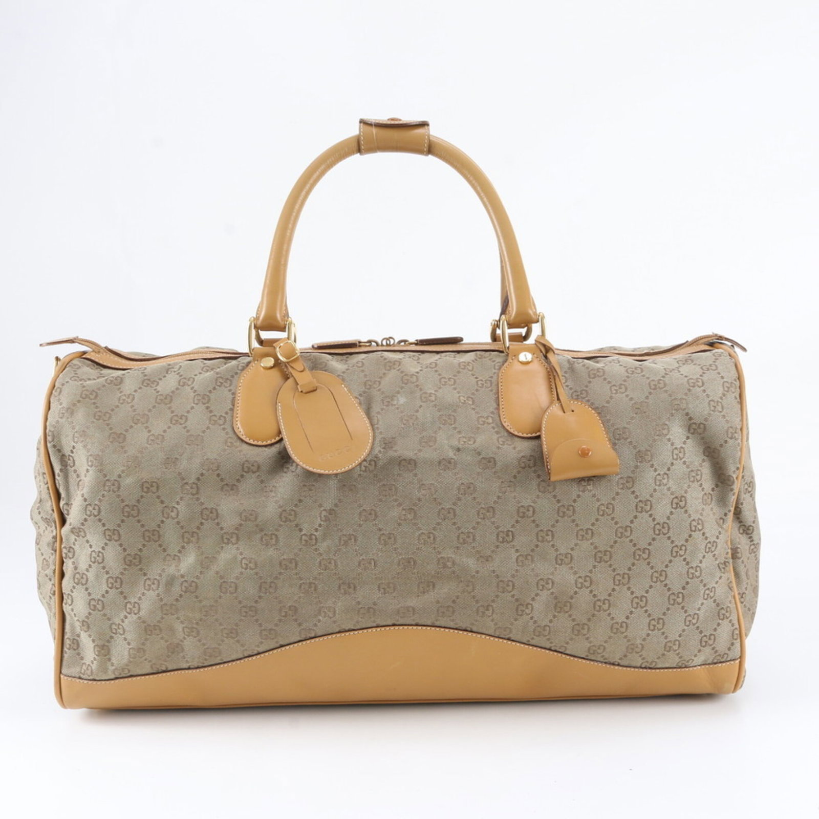 Canvas leather tote bag from Gucci Boston: Canvas leather tote bag from Gucci Boston The Gucci Boston canvas leather tote bag boasts a classic design with a timeless brown color and high-quality materials. Measuring 26cm x 53cm x 22cm, this