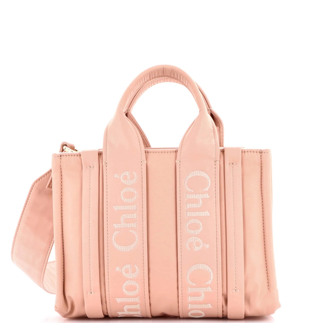 Chloe Recycled Nylon Small Convertible Tote: Chloe Recycled Nylon Small Convertible Tote The Chloe Recycled Nylon Small Convertible Tote boasts a vibrant pink exterior made from high-quality recycled nylon, featuring a chic and versatile