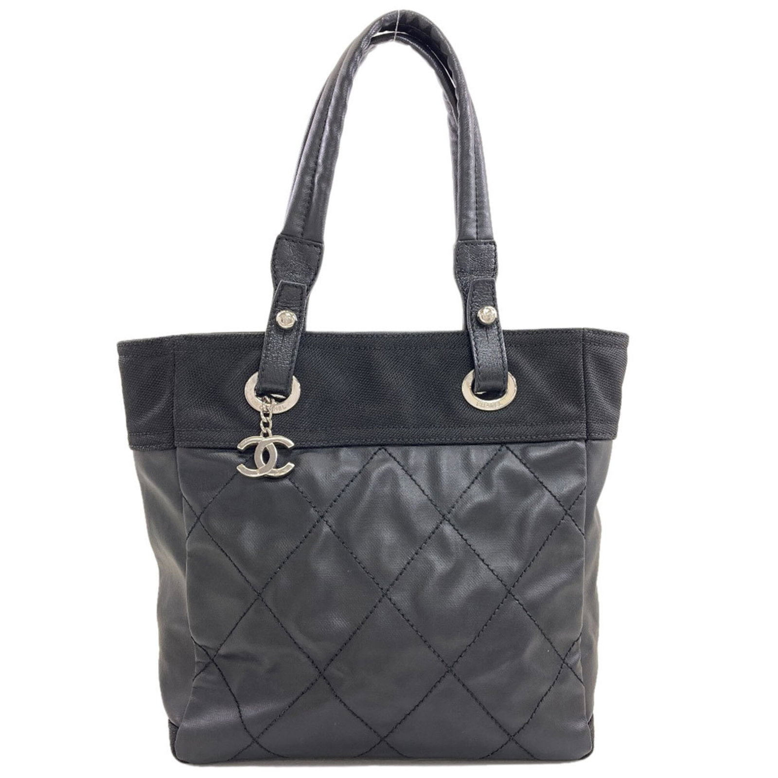 Coated Canvas Handbag Chanel: Coated Canvas Handbag Chanel Coated canvas handbag with sleek black finish, measuring 28cm x 26cm x 11.5cm. This Chanel handbag boasts a durable coated canvas material, providing a stylish and