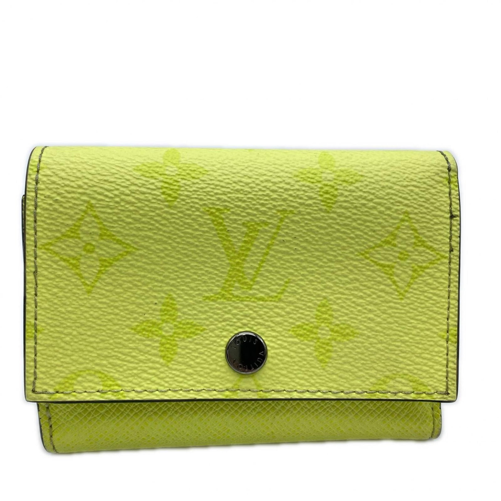 Louis Vuitton Wallet (Tri-Fold) Coated Canvas: Louis Vuitton Wallet (Tri-Fold) Coated Canvas Yellow Louis Vuitton Taigarama Tri-Fold Wallet with Coated Canvas Material. This tri-fold wallet features a bright yellow color and measures 8.5cm x 11cm