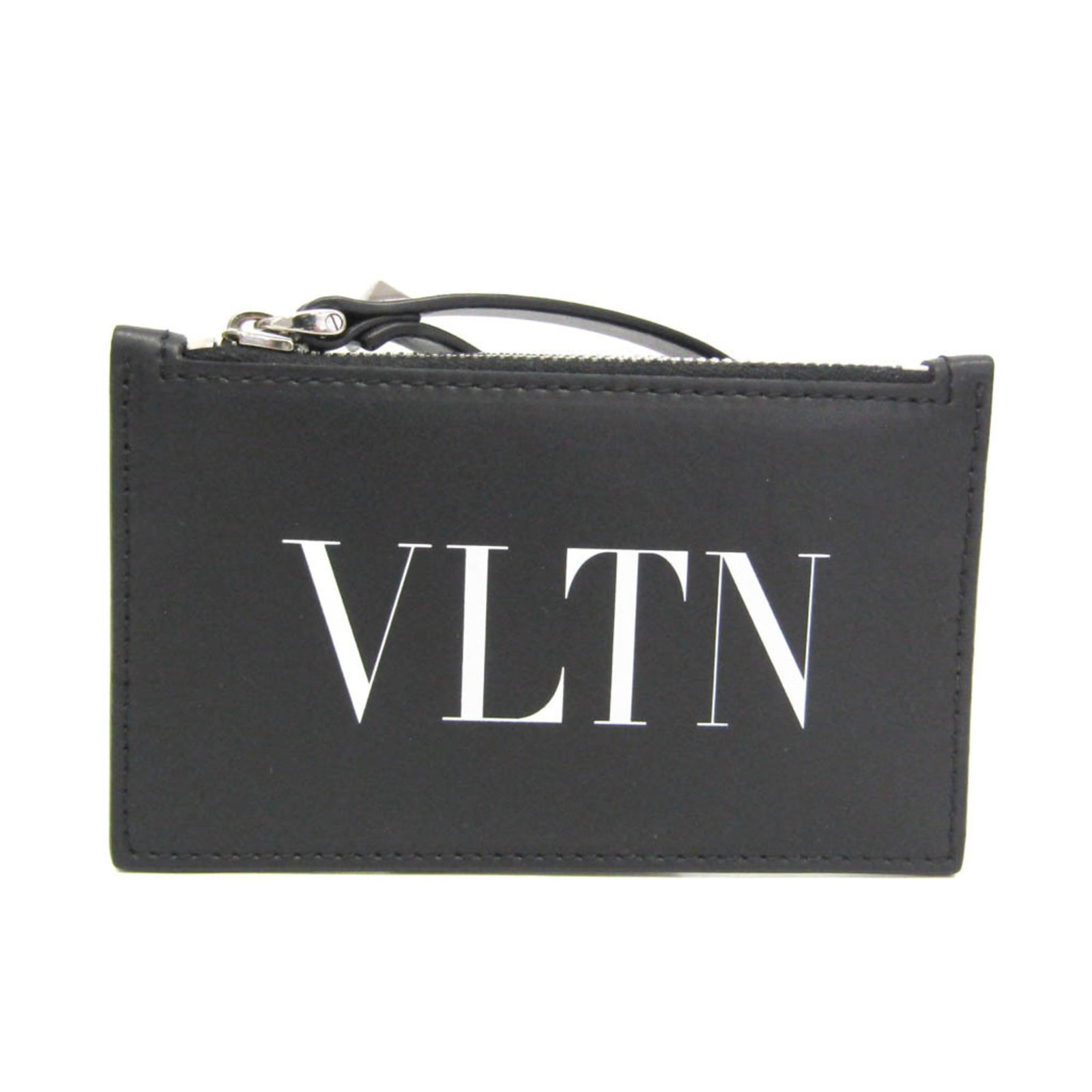 Garavani Valentino Coin Leather Purse: Garavani Valentino Coin Leather Purse The Garavani Valentino Coin Leather Purse is a sleek and sophisticated accessory. Made from high-quality black leather, this coin purse features a secure zipper