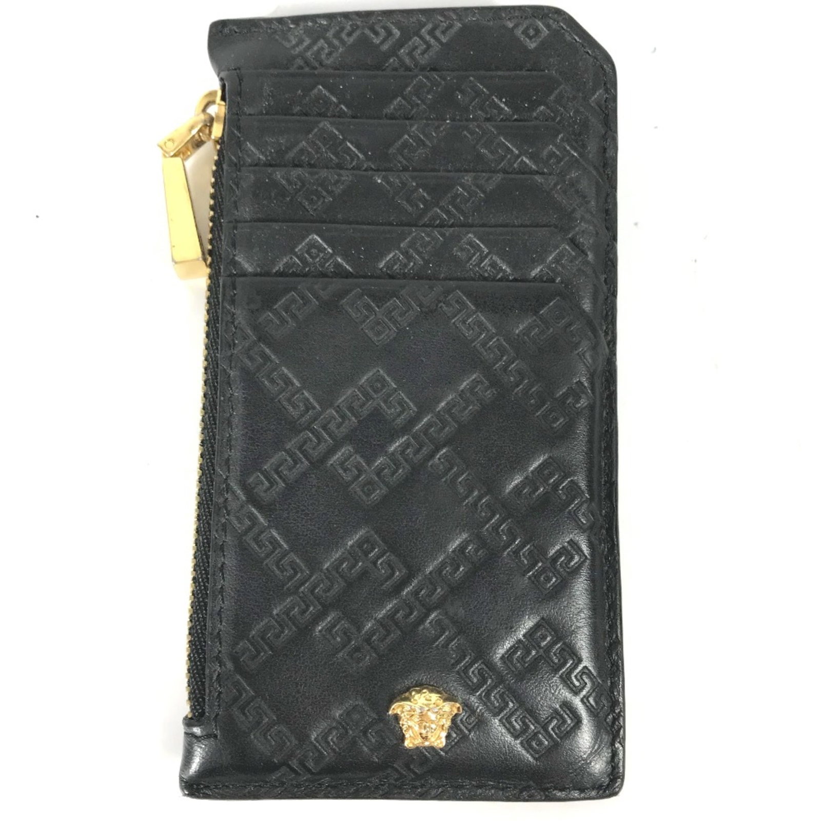 Versace Coin Purse/ Coin Case Leather: Versace Coin Purse/ Coin Case Leather This sleek Versace coin purse is crafted from high-quality black leather, measuring 6.5cm x 12.5cm in size. The simple yet stylish design makes it a versatile