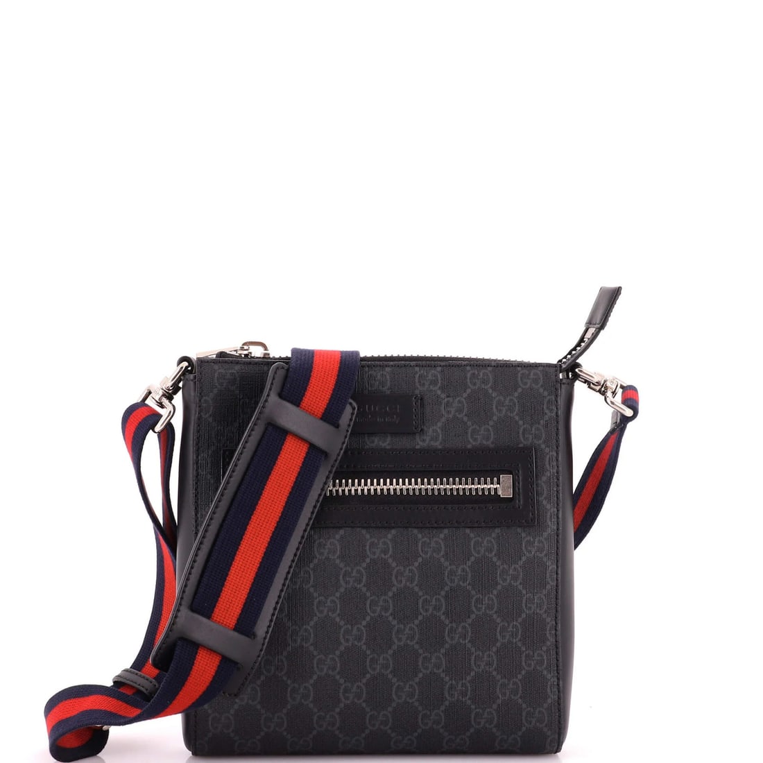 Front GG Coated Canvas Small Web Strap Zip Messenger Bag: Front GG Coated Canvas Small Web Strap Zip Messenger Bag Small Web Strap Zip Messenger Bag with GG Coated Canvas Exterior in Black. This stylish cross body bag features a front zip closure and a web s