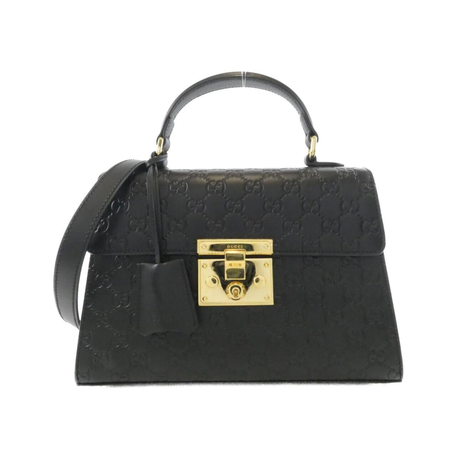 Handbag Leather Gucci: Handbag Leather Gucci This black leather Gucci handbag boasts a sleek design with gold hardware, measuring 19cm x 28cm x 11cm. The bag's luxurious leather material provides a sophisticated touch,