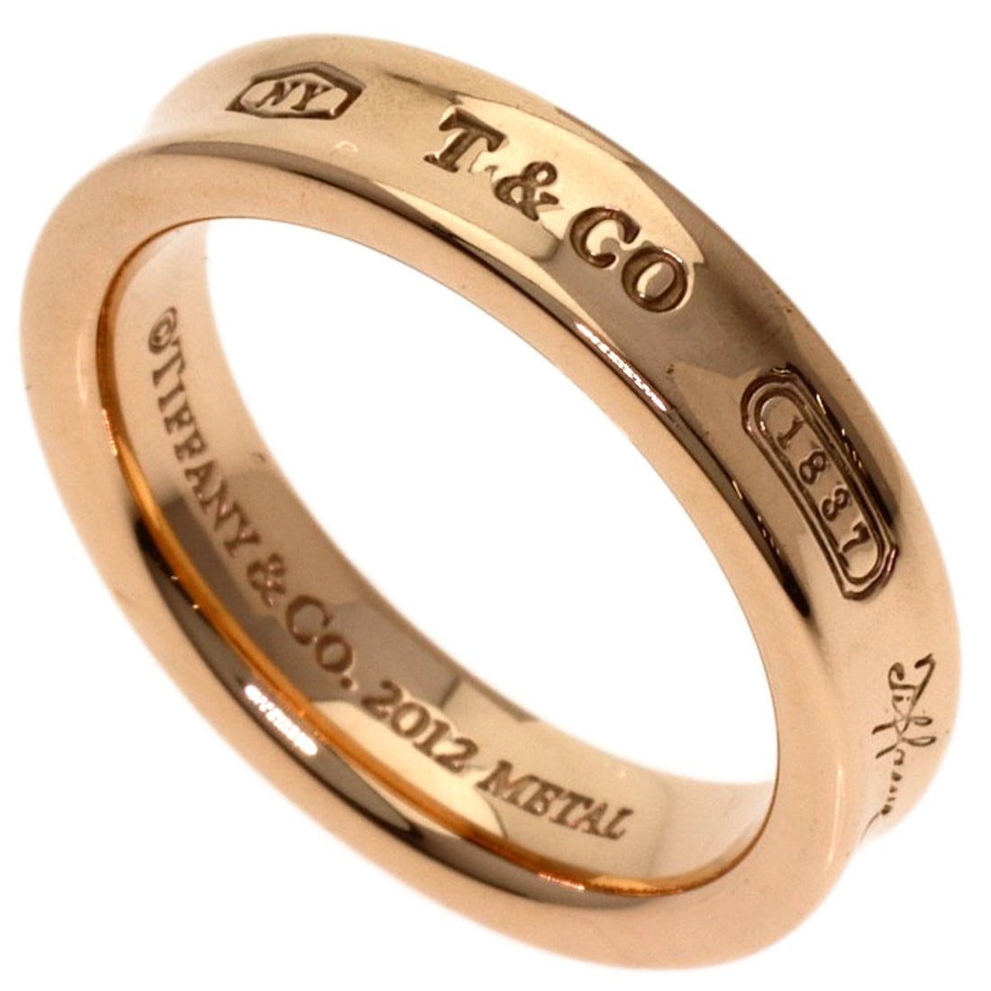 Rubet Metal Tiffany&Co. 1837 Narrow Metal Ring: Rubet Metal Tiffany&Co. 1837 Narrow Metal Ring Rubet Metal Tiffany&Co. 1837 Narrow Metal Ring is a gold ring featuring rubet metal construction, with no stone. This 4(US) ring bears a signature and
