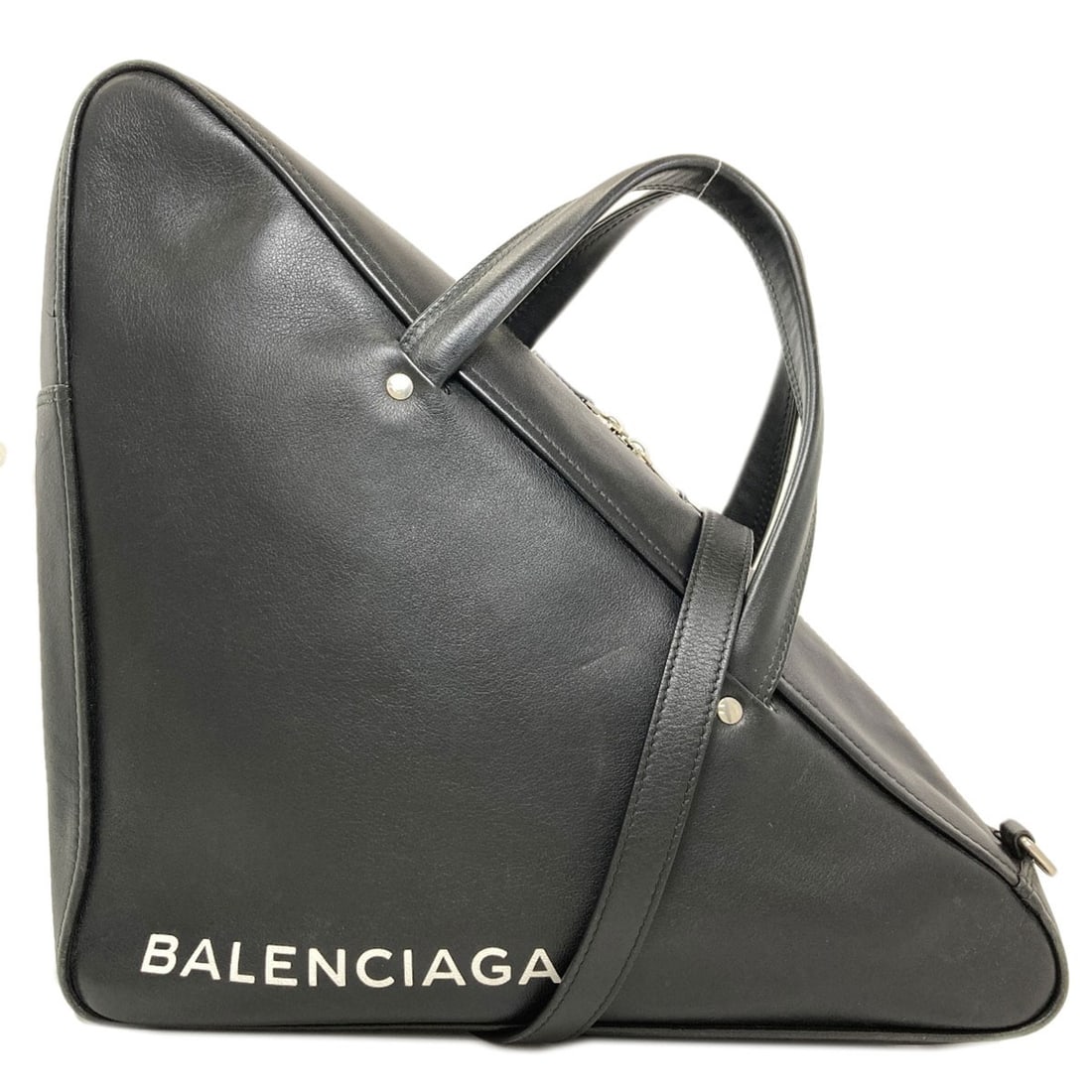 Leather Handbag Duffle Triangle 2Way Balenciaga: Leather Handbag Duffle Triangle 2Way Balenciaga Black leather duffle bag with a unique triangle shape and 2-way design, characteristic of Balenciaga's signature style. This handbag features a sleek