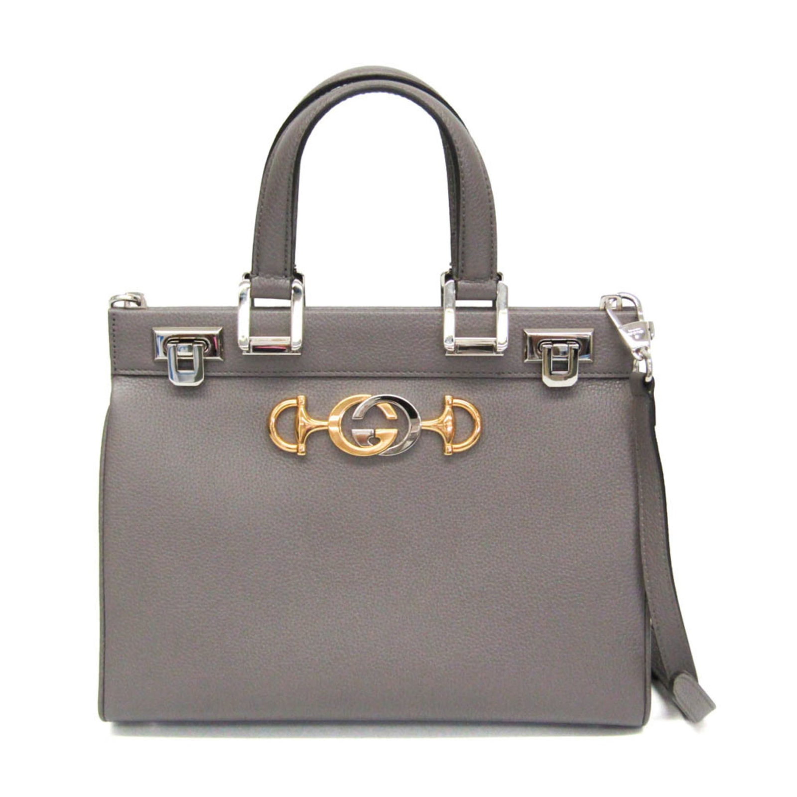 Shoulder Bag Leather Handbag Gucci: Shoulder Bag Leather Handbag Gucci Gucci's Zumi 569712 shoulder bag is a stylish and practical accessory, featuring a sleek gray leather design with a fastener closure and a convenient zipper pocket