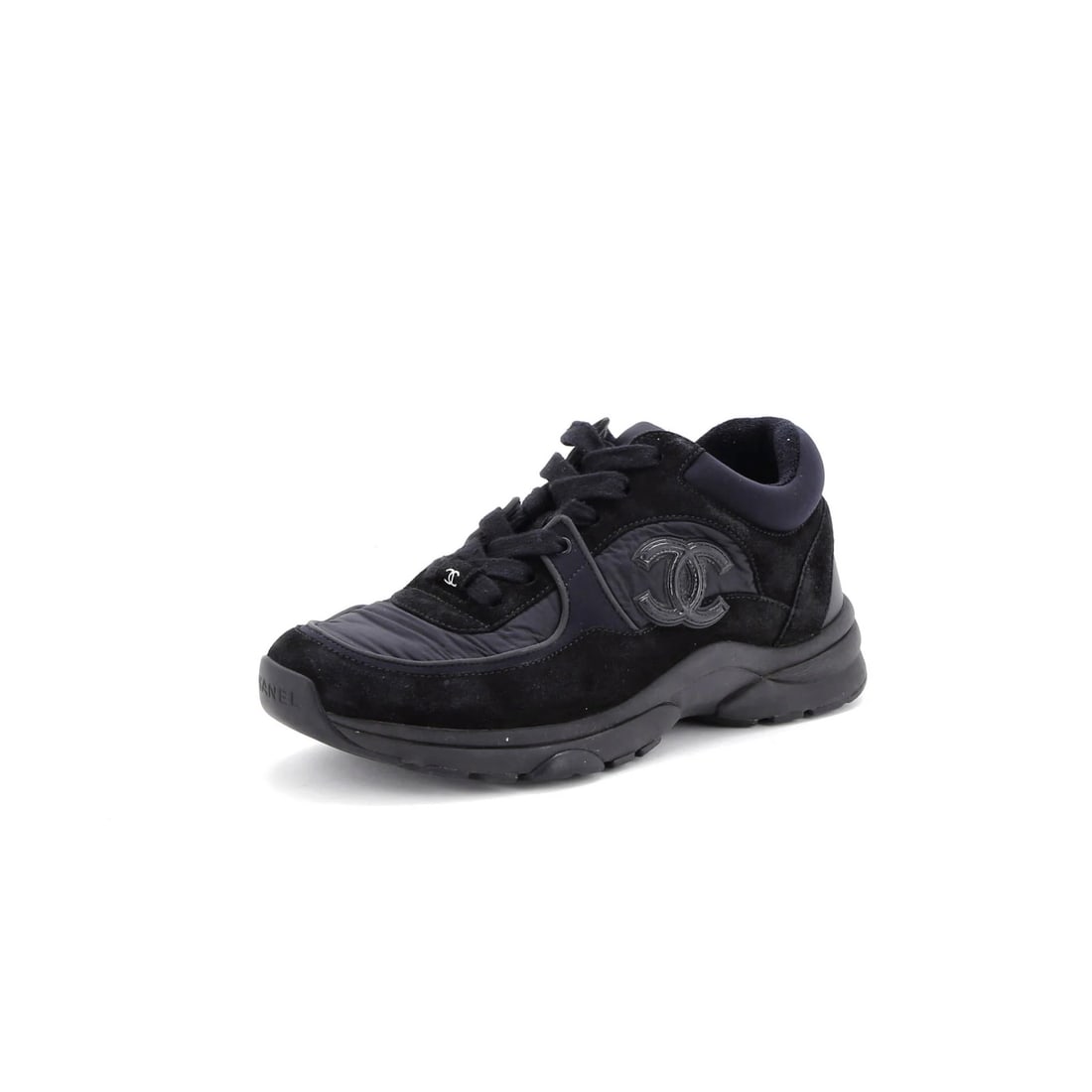 Chanel Women's Suede with Leather Low Top Sneakers: Chanel Women's Suede with Leather Low Top Sneakers Black leather and suede low-top sneakers from Chanel, featuring a classic design with a suede and leather exterior and a nylon upper. The shoes have 