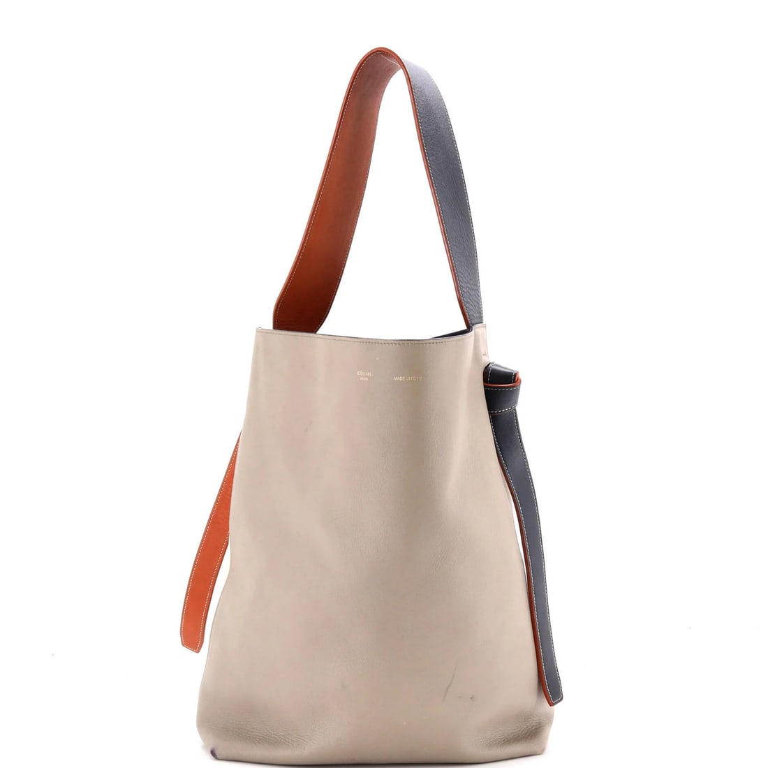 Twisted Calfskin Oversized Tote Celine Cabas: Twisted Calfskin Oversized Tote Celine Cabas Twisted Calfskin Oversized Tote Celine Cabas features a neutral exterior with heavy corner wear, cracking, scuffs, and edge wear, giving it a unique,