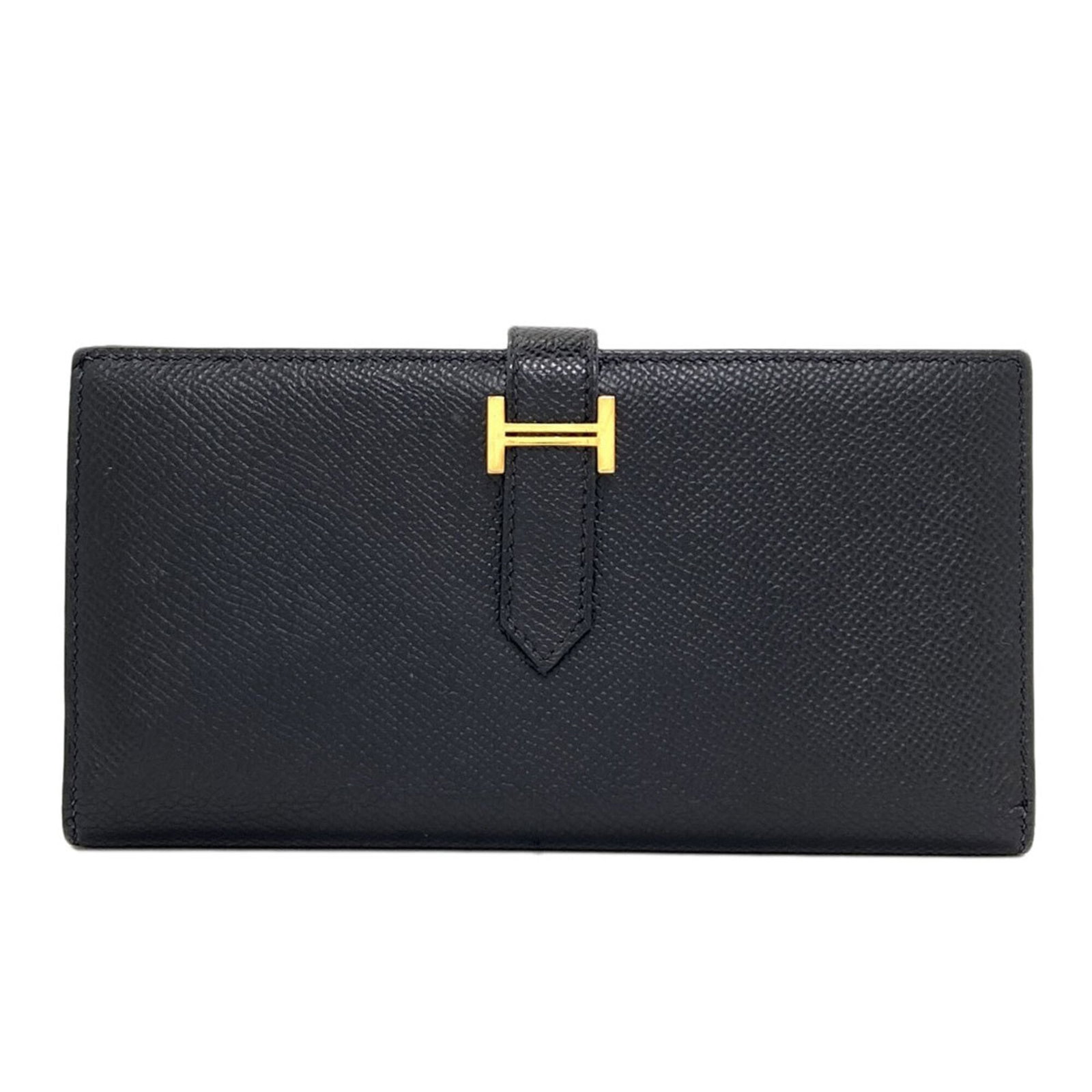 Epsom Leather Bi fold Wallet Hermes: Epsom Leather Bi fold Wallet Hermes Epsom leather, a rich and supple material, is used to craft this elegant bi-fold wallet from the renowned brand Hermes. The sleek black design features a belt