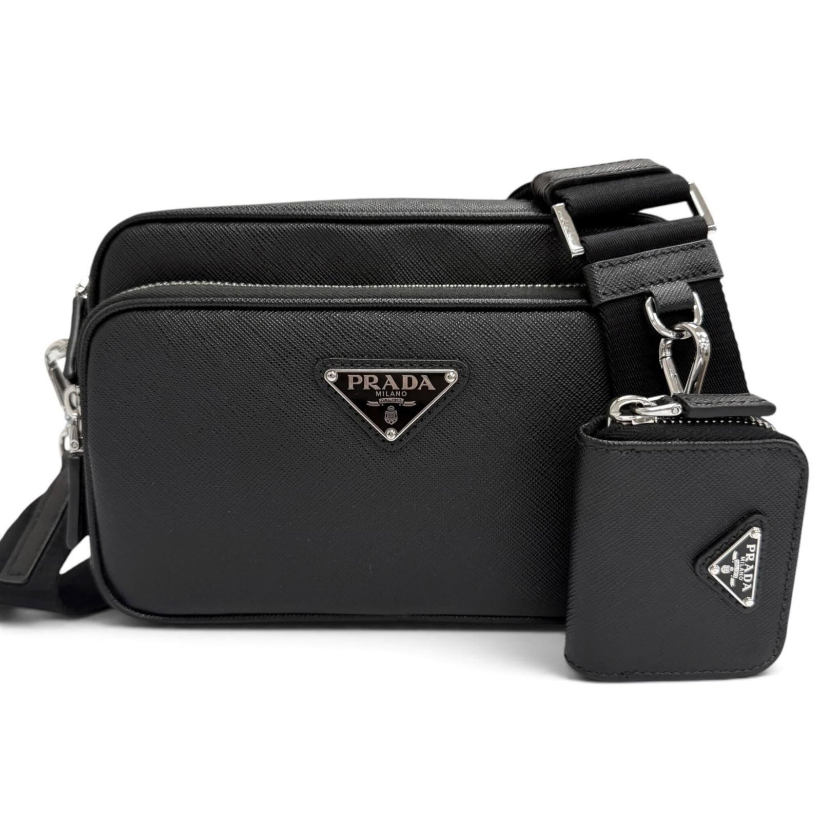 Shoulder Bag Pouch Leather Prada: Shoulder Bag Pouch Leather Prada Saffiano leather, a signature material of luxury Italian design, adorns this sleek shoulder bag pouch from Prada. Measuring 15.5cm x 20cm x 5cm, it features a classic