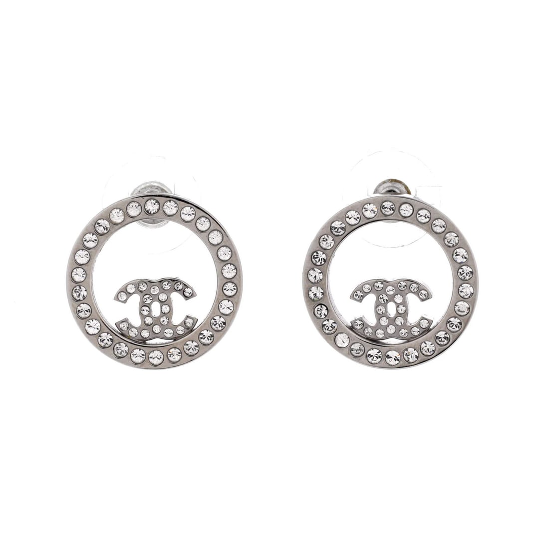 Chanel Cut CC Round Earrings with Crystals Metal Stud: Chanel Cut CC Round Earrings with Crystals Metal Stud Silver Chanel Cut CC Round Earrings with Crystals Metal Stud feature a unique round CC cut out stud design, adorned with crystals, and have a silv