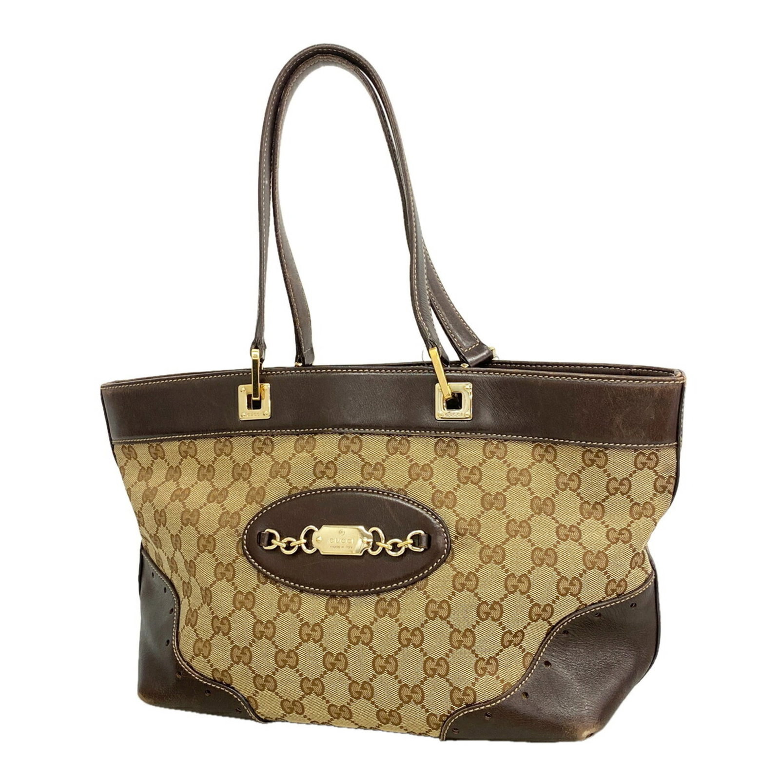 Canvas Gucci Tote Bag: Canvas Gucci Tote Bag Canvas Gucci Tote Bag in Beige and Brown. This stylish tote features a canvas material, gold hardware, and a signature that bears a mark. Standing 23cm x 29cm x 13.5cm, it makes