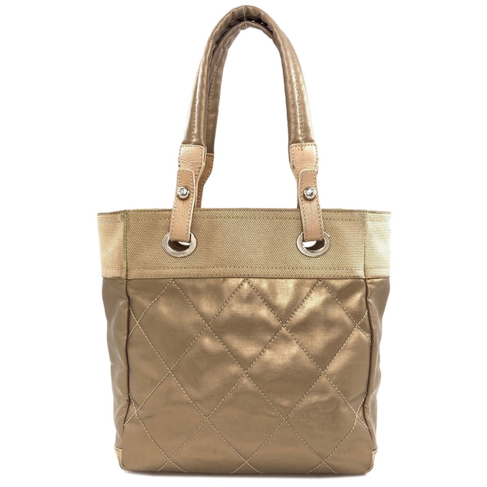 Canvas leather tote bag: Canvas leather tote bag Canvas leather tote bag in gold, measuring 27cm x 32cm x 11cm, features a combination of canvas and leather materials. The bag's gold color and size make it a stylish and pract