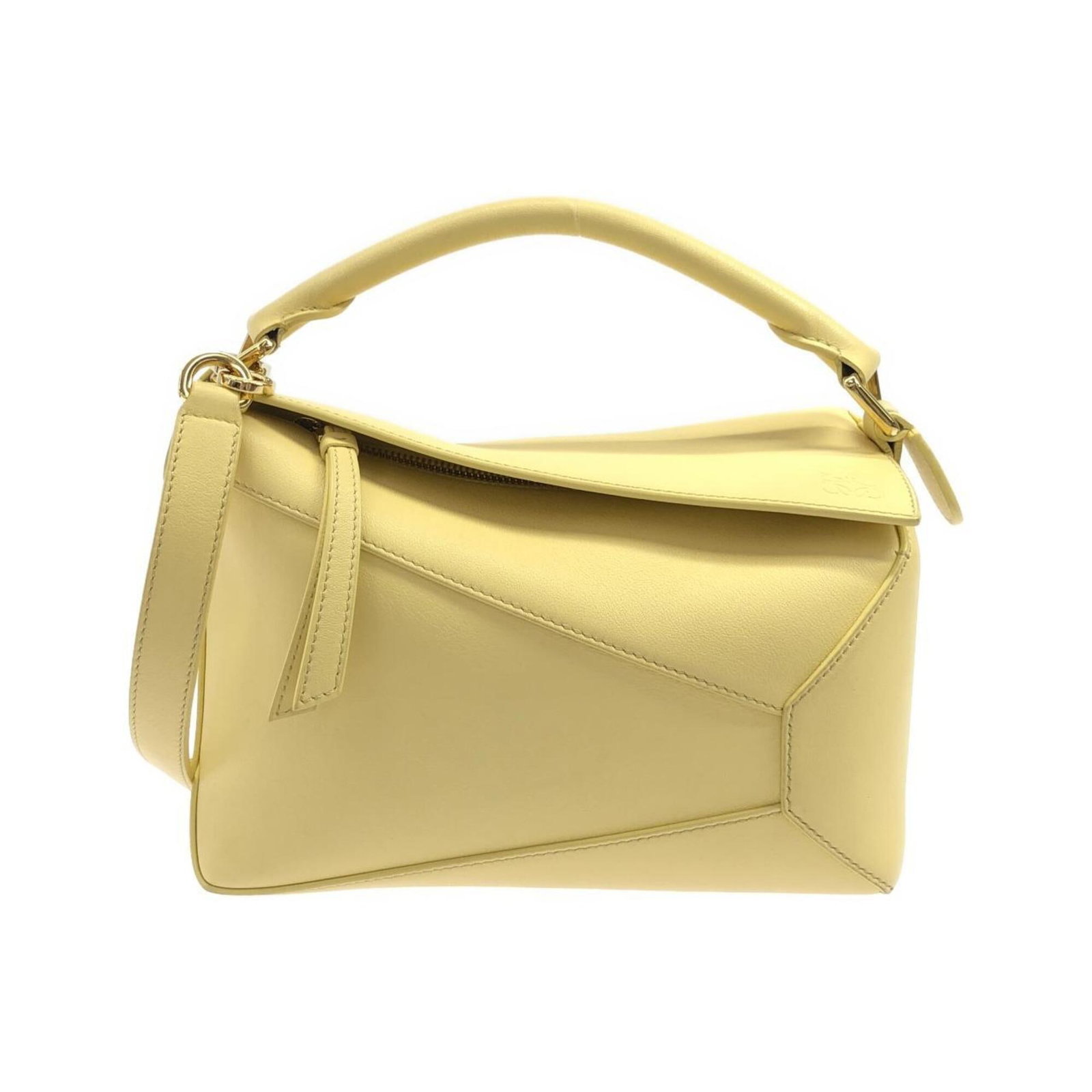 Handbag Leather Handbag: Handbag Leather Handbag The handbag is made from high-quality leather and features a bright yellow color. It measures 17cm x 24cm x 11cm and has a sleek design. The bag bears a signature. Item Specifi