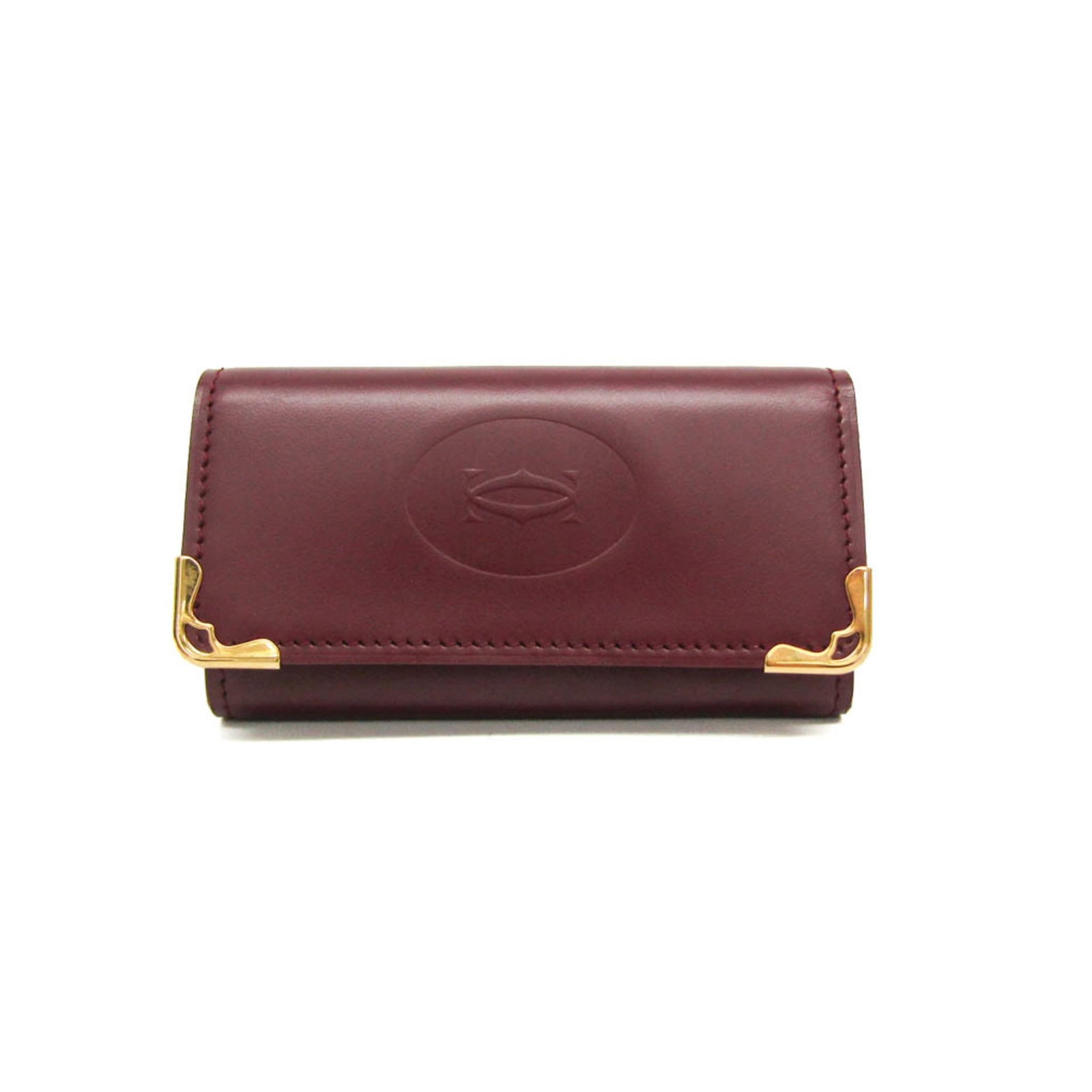 Keycase Leather: Keycase Leather Bordeaux leather keycase from Cartier, featuring a classic design with a snap closure and open pocket, perfect for everyday use. Made from high-quality calfskin, this keycase is both