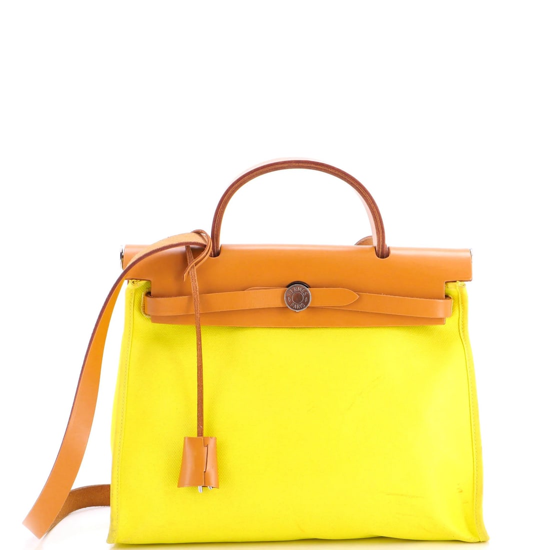 Hermes Herbag Zip Berline Vache Canvas and Leather 31: Hermes Herbag Zip Berline Vache Canvas and Leather 31 Yellow Hermes Herbag Zip Berline Vache Canvas and Leather 31 shoulder bag features a canvas-coated leather exterior and a neutral interior. The