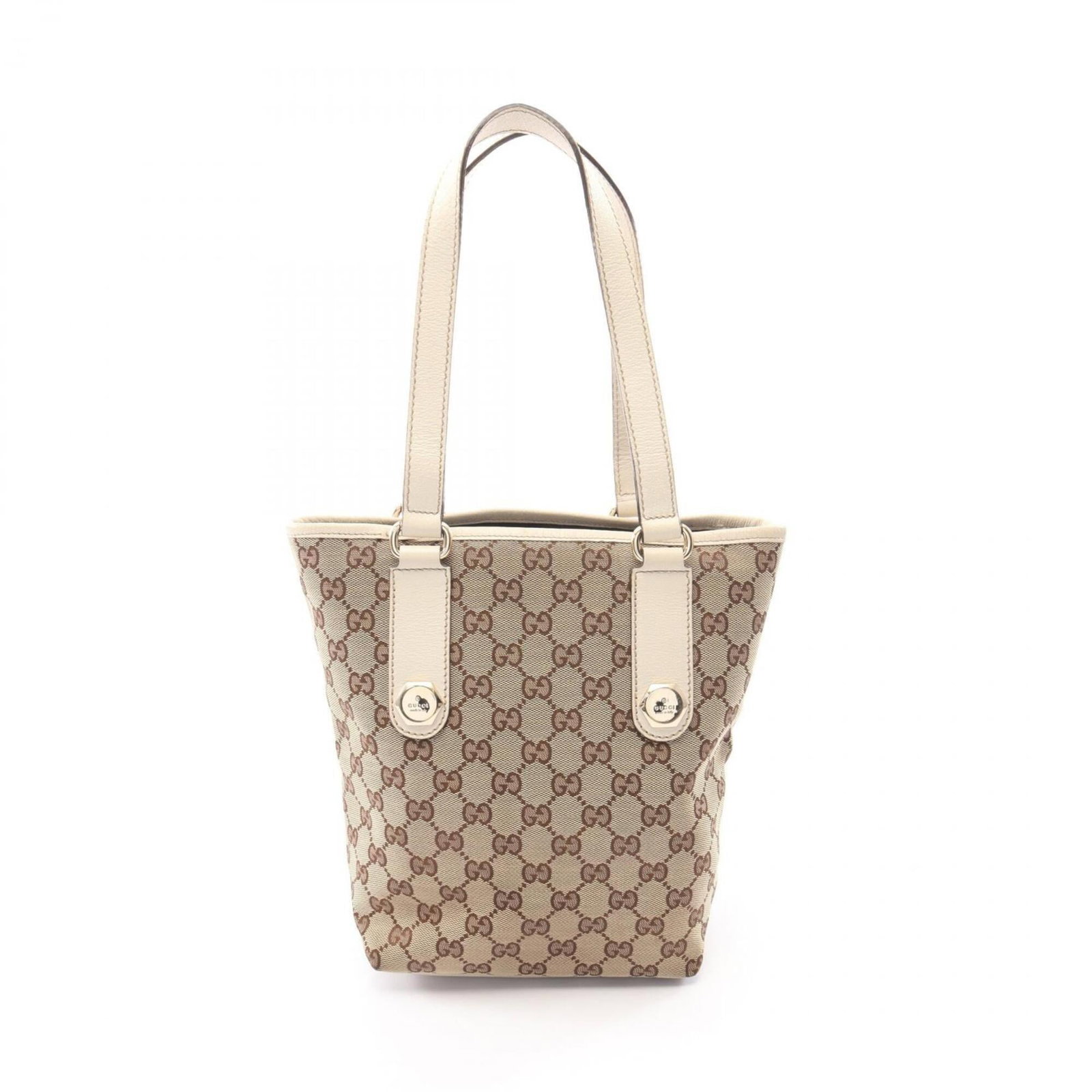 Canvas Leather Gg Gucci Tote Handbag: Canvas Leather Gg Gucci Tote Handbag GG canvas and leather combine in this elegant beige and ivory Gucci tote bag, measuring 25cm x 18cm x 10cm. The iconic GG canvas pattern adds a touch of