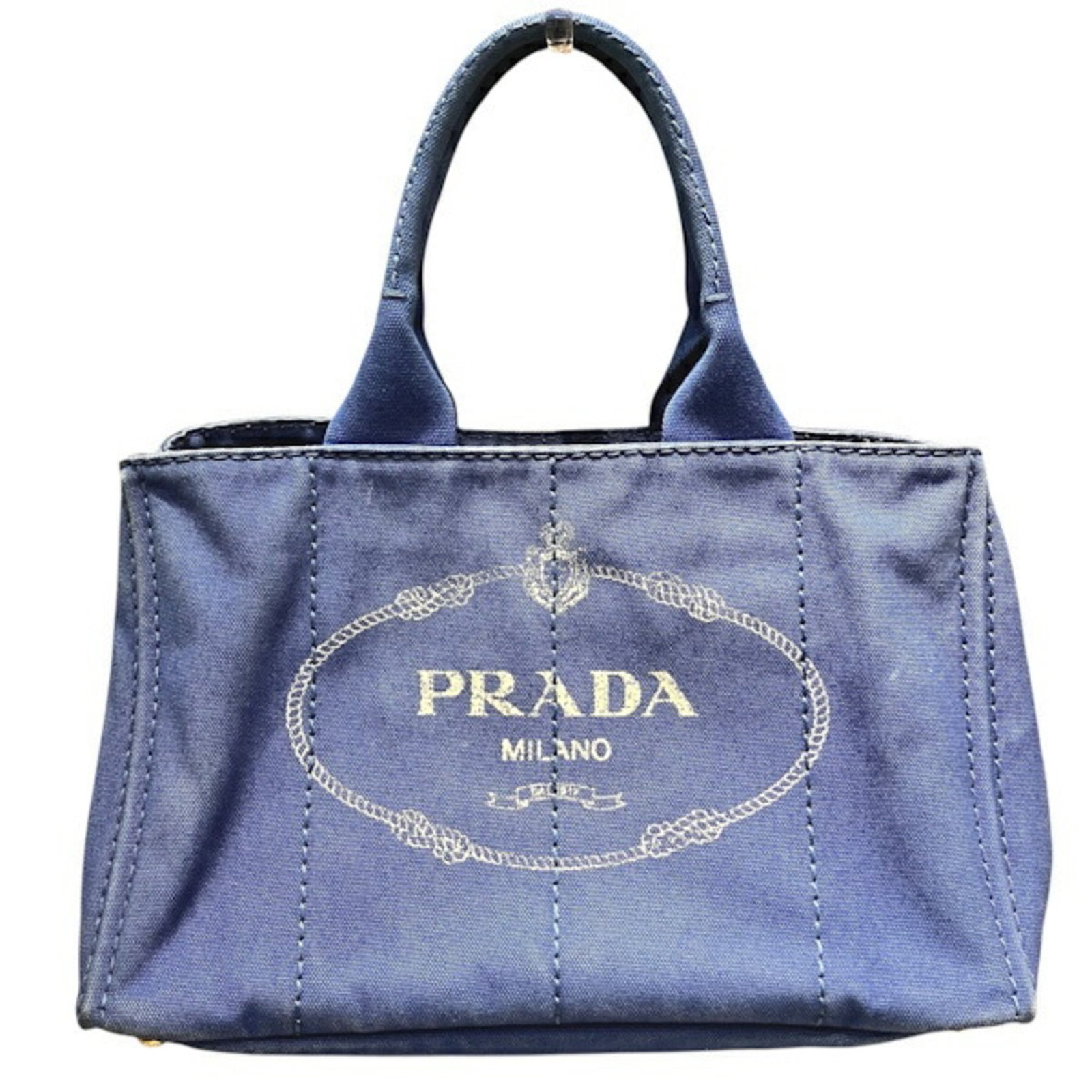 Canvas tote bag Prada handbag: Canvas tote bag Prada handbag Canvas tote bag from Prada, featuring a blue canvas material and a 40cm handle length. This Prada Canapa tote bag measures 20cm x 35cm x 20cm and has a distinctive blue