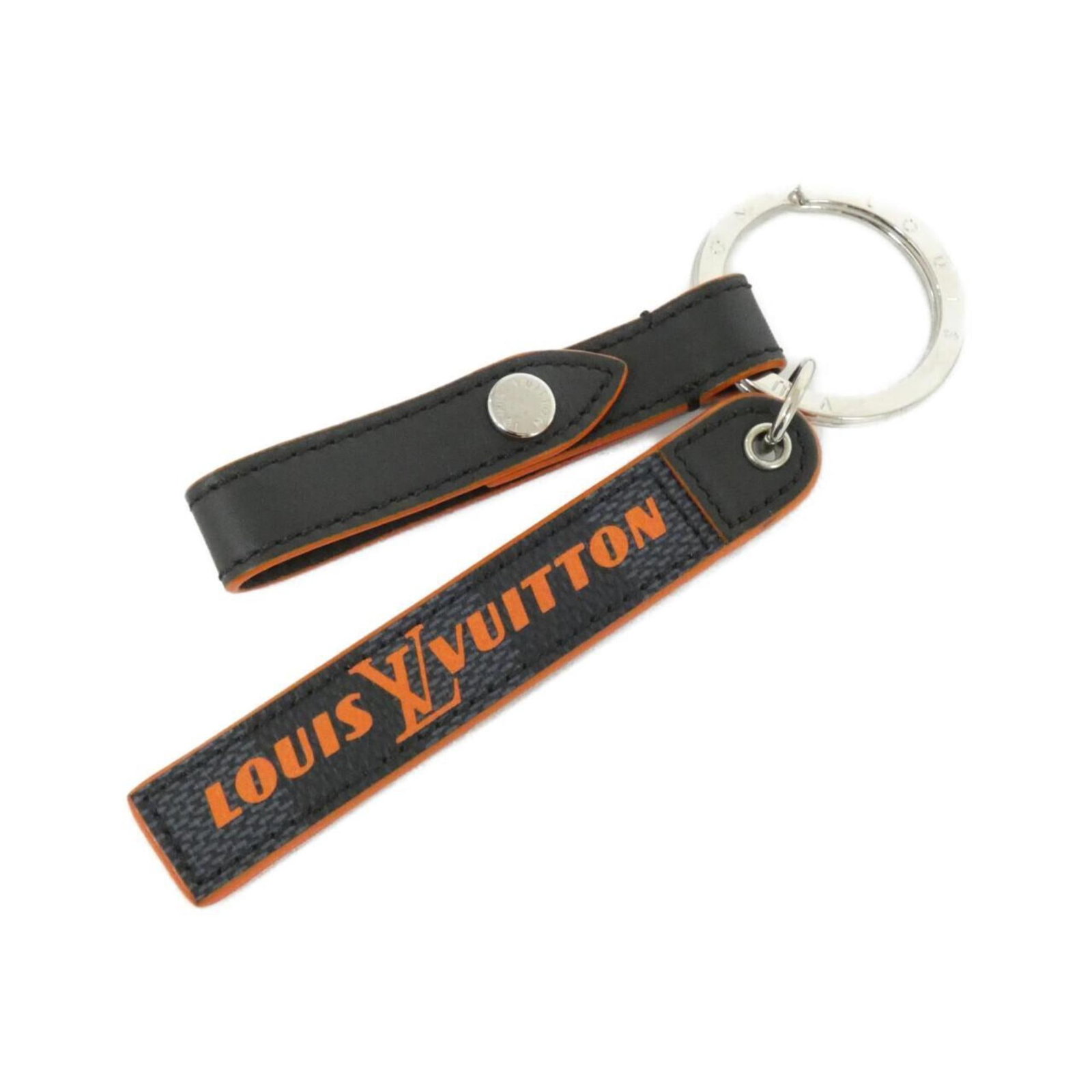 Louis Vuitton Canvas Keyring: Louis Vuitton Canvas Keyring Canvas keyring from Louis Vuitton, available in black, cobalt, and silver hues, featuring a canvas material. This stylish accessory showcases the iconic brand's signature