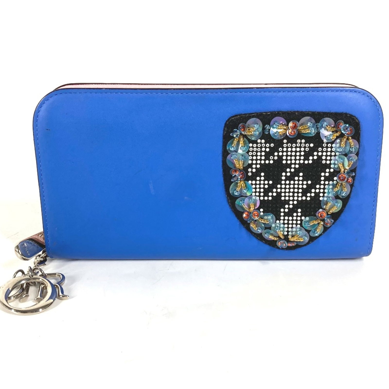 Long Leather Christian Dior Bi Fold Wallet: Long Leather Christian Dior Bi Fold Wallet Long Leather Christian Dior Bi Fold Wallet in Blue. This bi-fold wallet features a classic design with a long, blue leather strap and a compact interior,