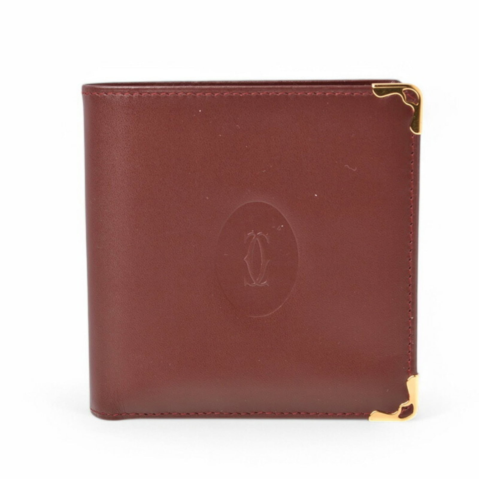 Cartier Wallet (Bi-Fold) Leather: Cartier Wallet (Bi-Fold) Leather Cartier Wallet (Bi-Fold) Leather is a high-quality, bi-fold wallet made from genuine leather. The Bordeaux color adds a touch of elegance to this classic design, while