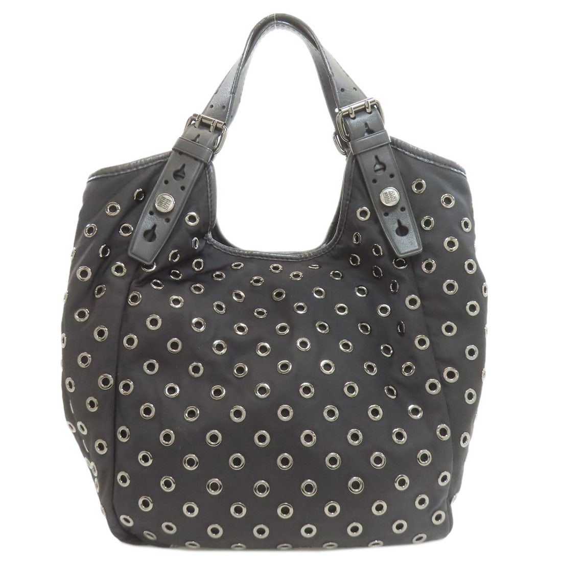 Nylon Givenchy Punching Tote Bag: Nylon Givenchy Punching Tote Bag Black Nylon Givenchy Tote Bag with a sleek and modern design, made from durable nylon material. This stylish tote bag features a classic black exterior color, perfect