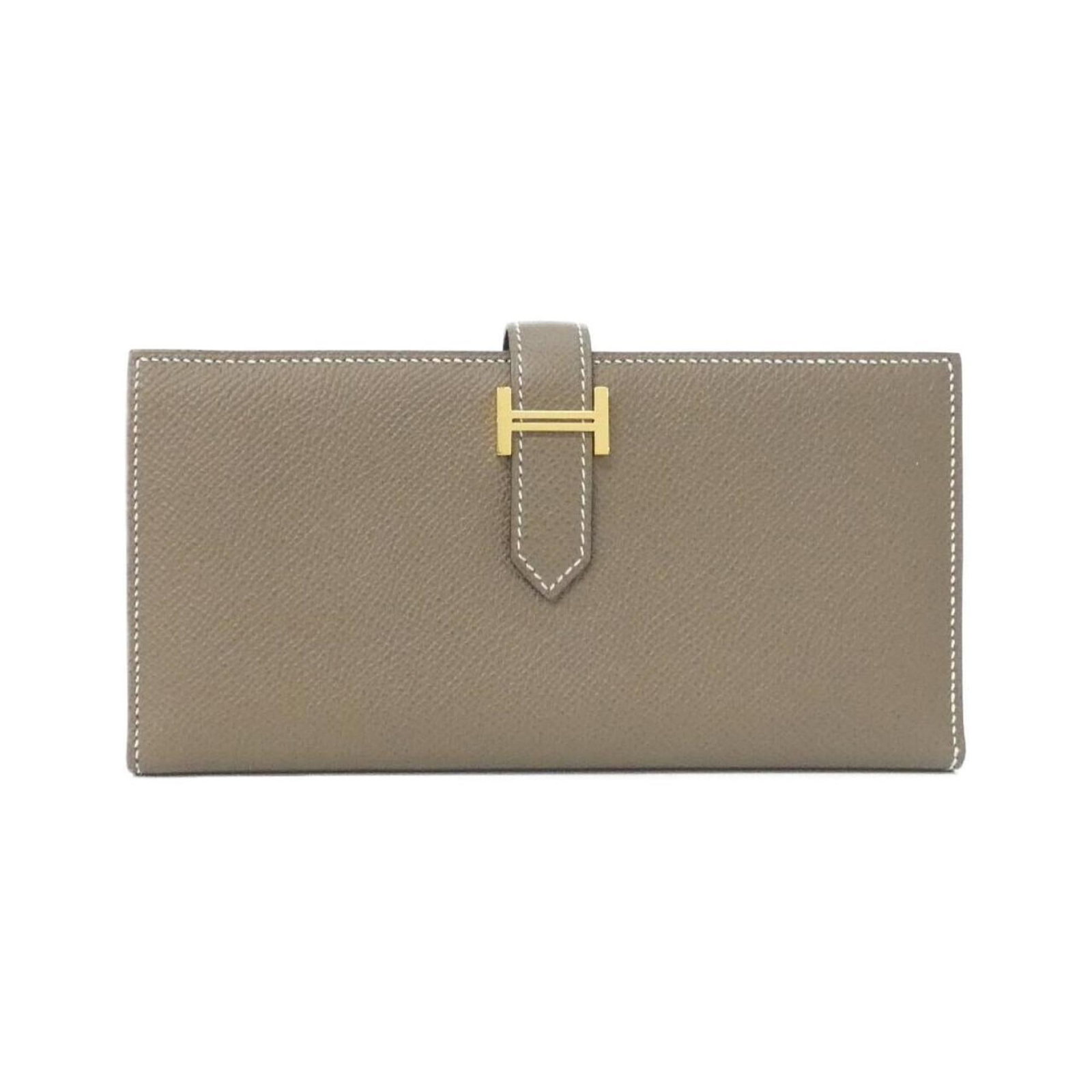 Epsom Leather Bi fold Wallet Hermes: Epsom Leather Bi fold Wallet Hermes Epsom leather provides a luxurious feel to this bi-fold wallet from Hermes, featuring a classic design with clean lines and a sophisticated gray Etoupe color.