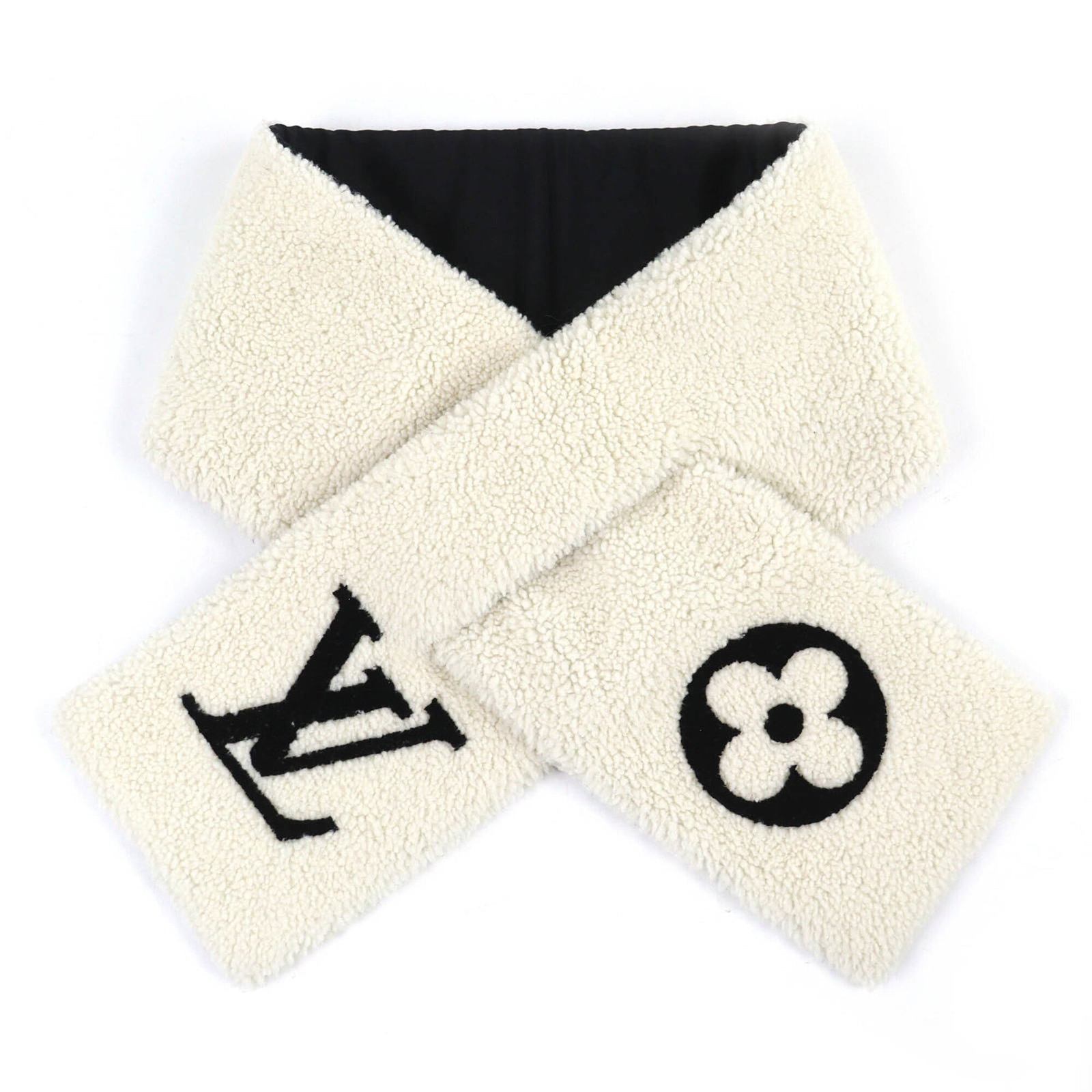 Silk Polyester Leather Stole by Louis Vuitton: Silk Polyester Leather Stole by Louis Vuitton Silk, Polyester, and Leather Stole from Louis Vuitton. This luxurious stole features a striking ivory color and combines the softness of silk, the durabil